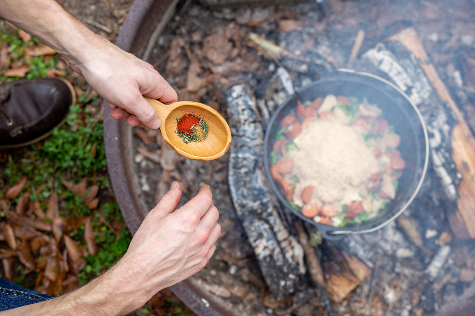 Adding rice and spices to the pot. 