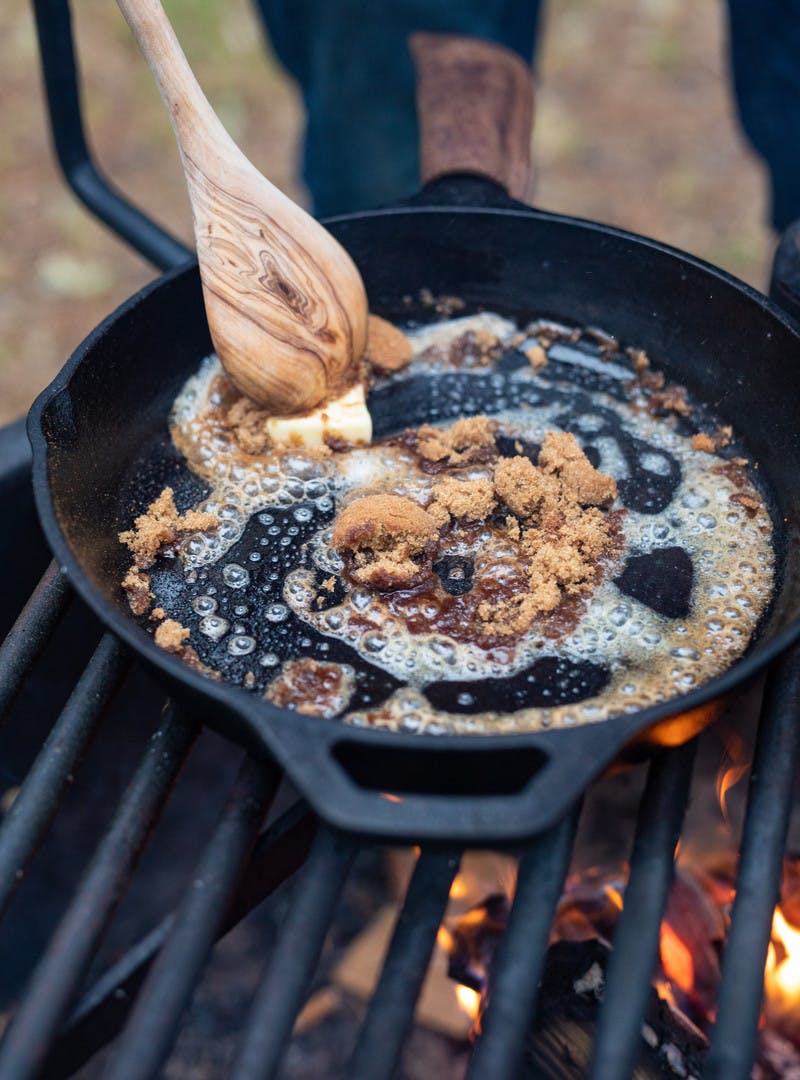 Mixing butter and sugar in the cast iron pan to cook the bananas foster.