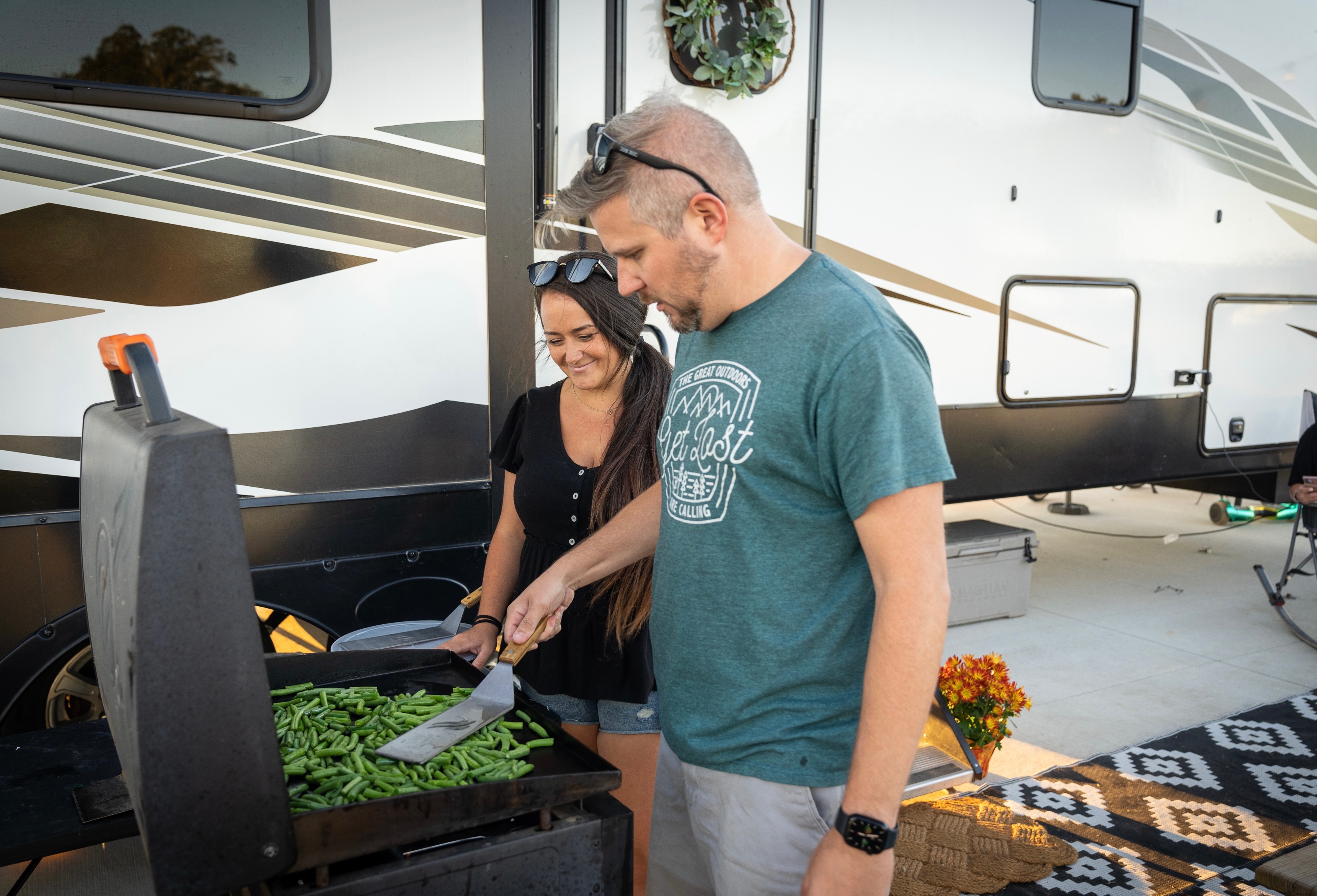 Amanda and Darren Bone family, Heartland Bighorn Traveler 39MB fifth wheel, grilling outside
