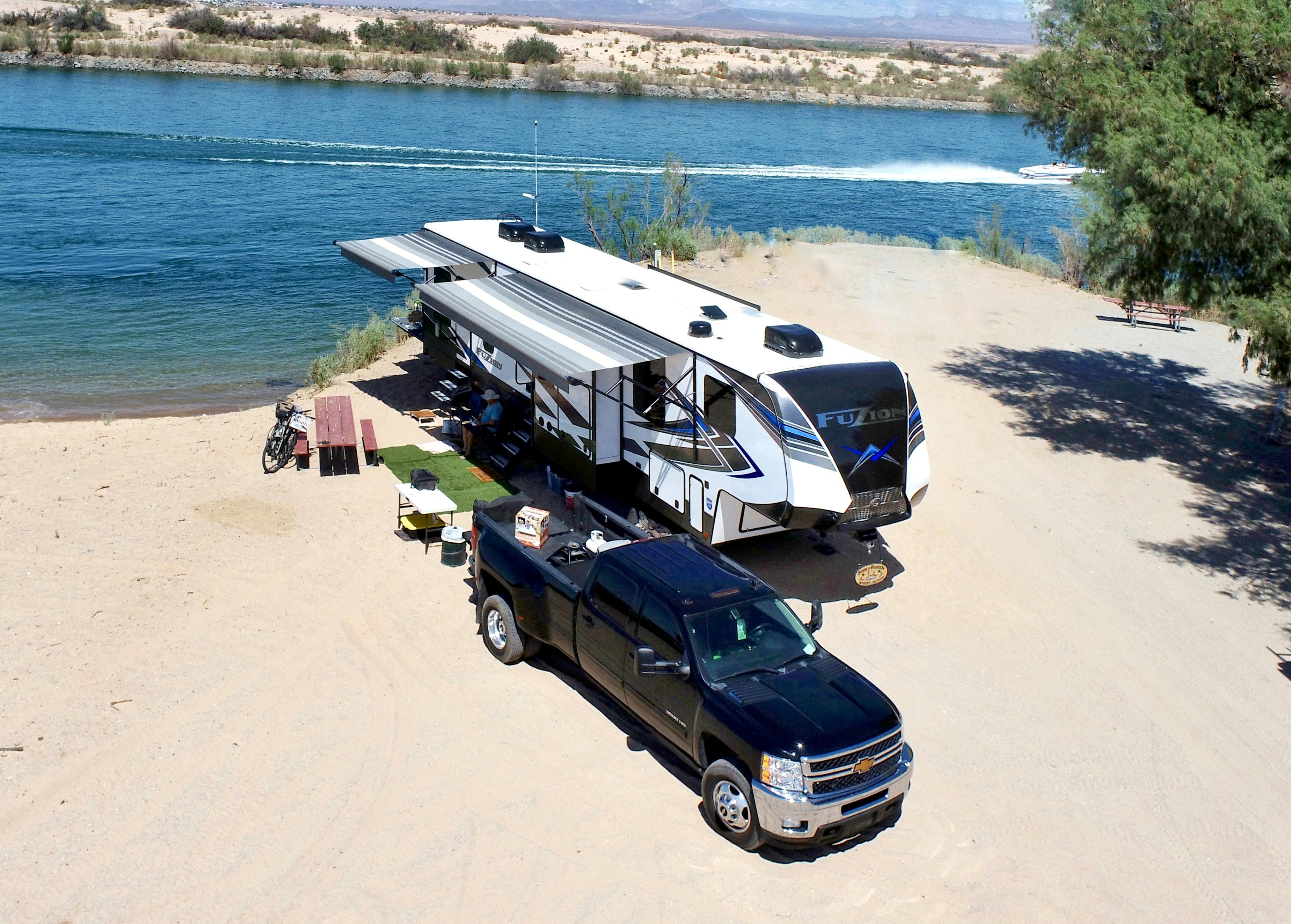 Robin and Warren Baxter's rv parked at a beach campsite at Pirate's Cove
