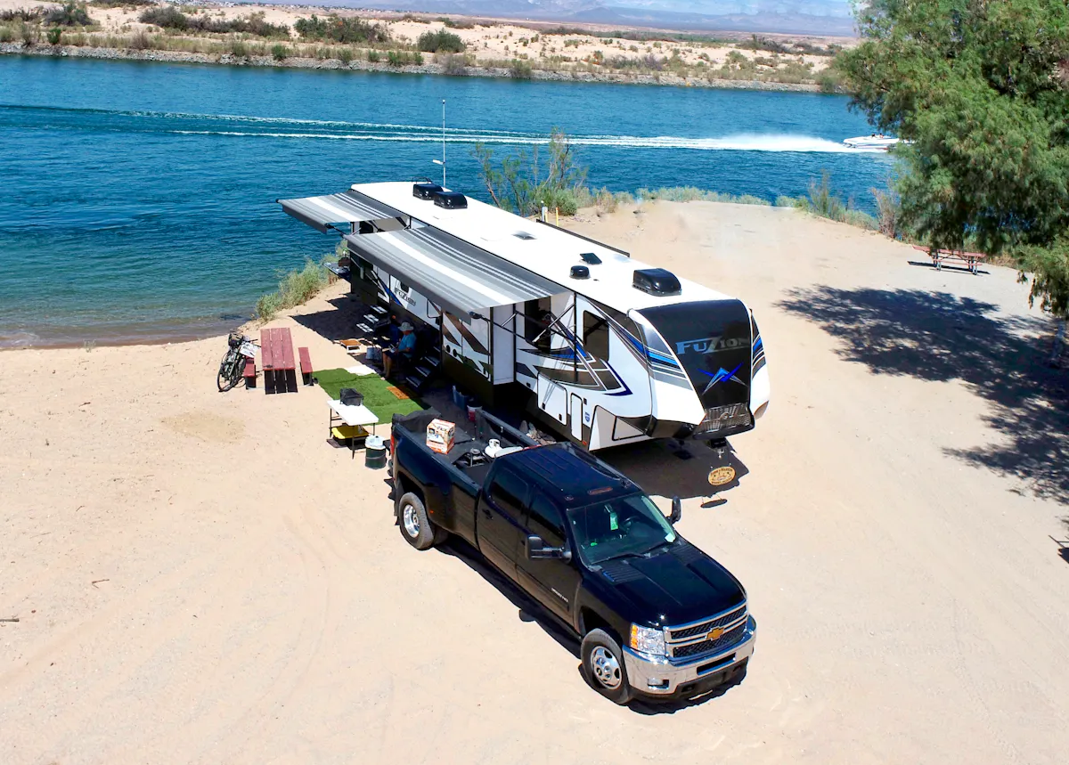 Robin and Warren Baxter's rv parked at a beach campsite at Pirate's Cove