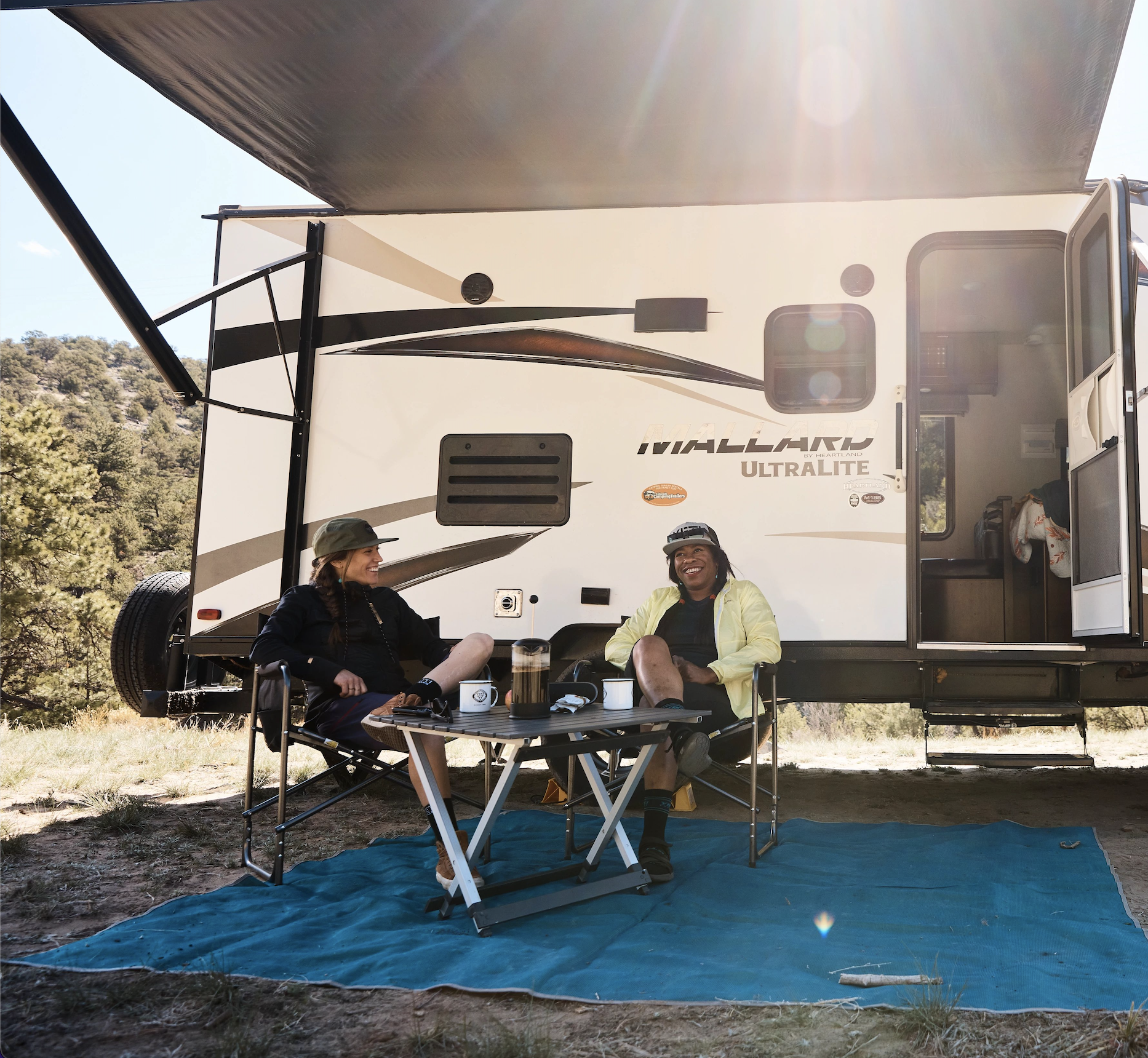 Britt and Brooke enjoying a cup of coffee in the morning outside of their RV
