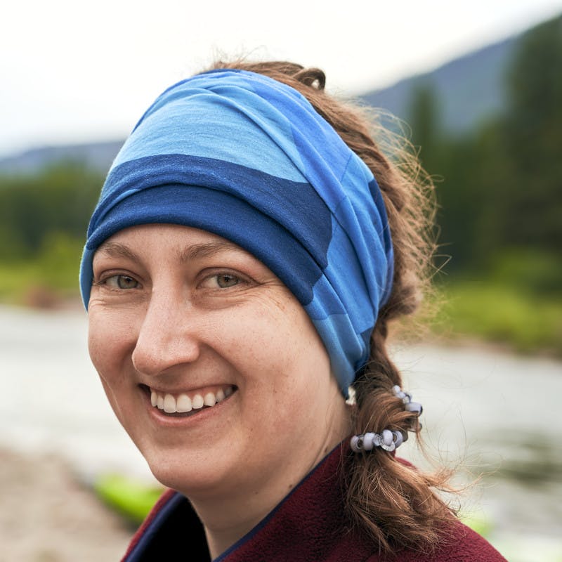 A portrait of a participant smiling in front of the Blackfoot River.