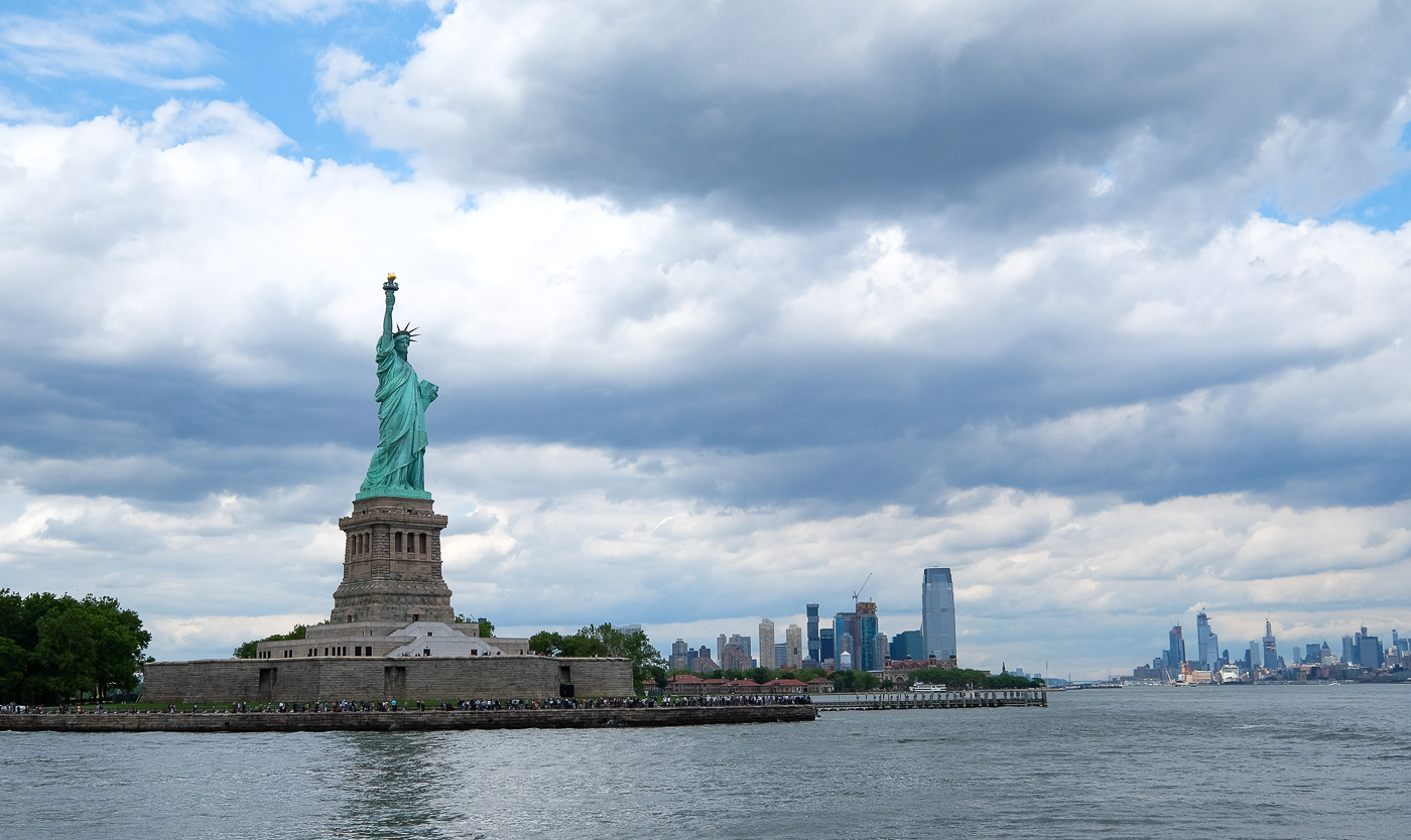 A shot of the statue of liberty from the water. 