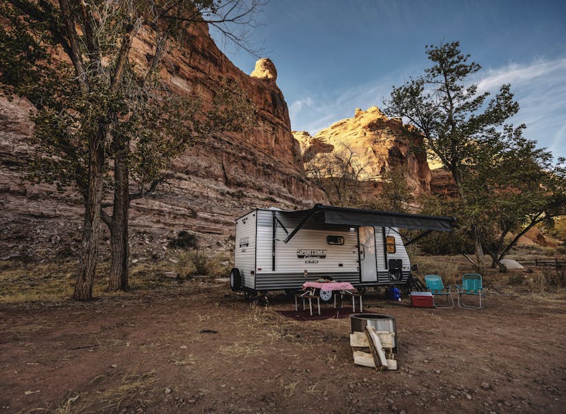 KZ Sportsmen Classic Lightweight Travel Trailer exterior with awning out