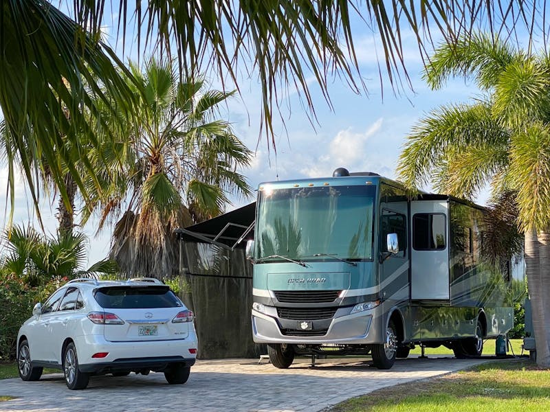 Michael & Tiffany Dunagan's RV parked at an RV campsite next to a parked car