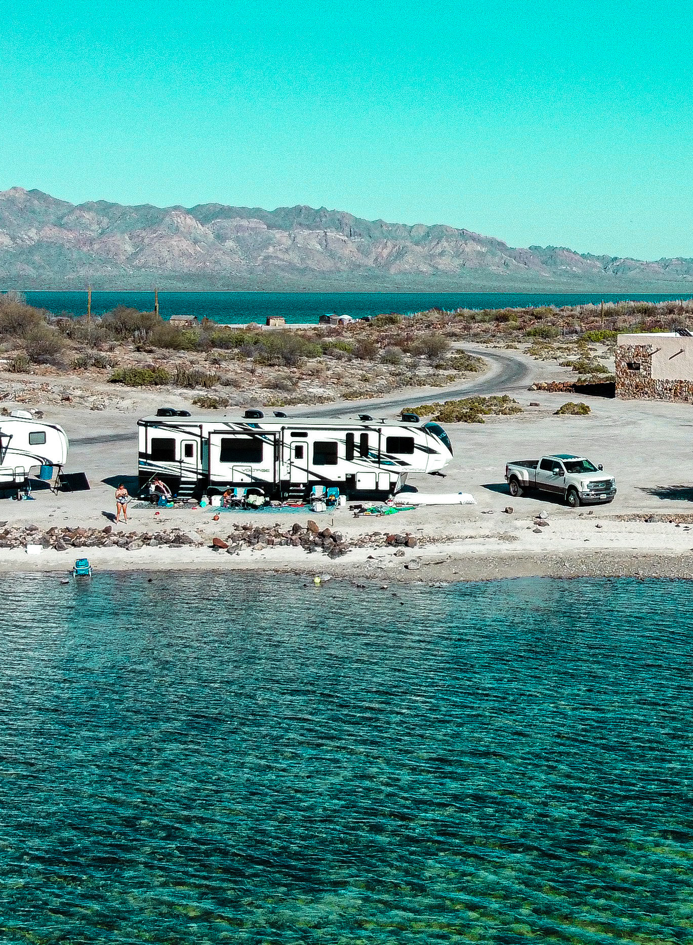 SAMANTHA BADERSCHNEIDER AND BLAKE EDMUNDS RV boondocking near a lake 