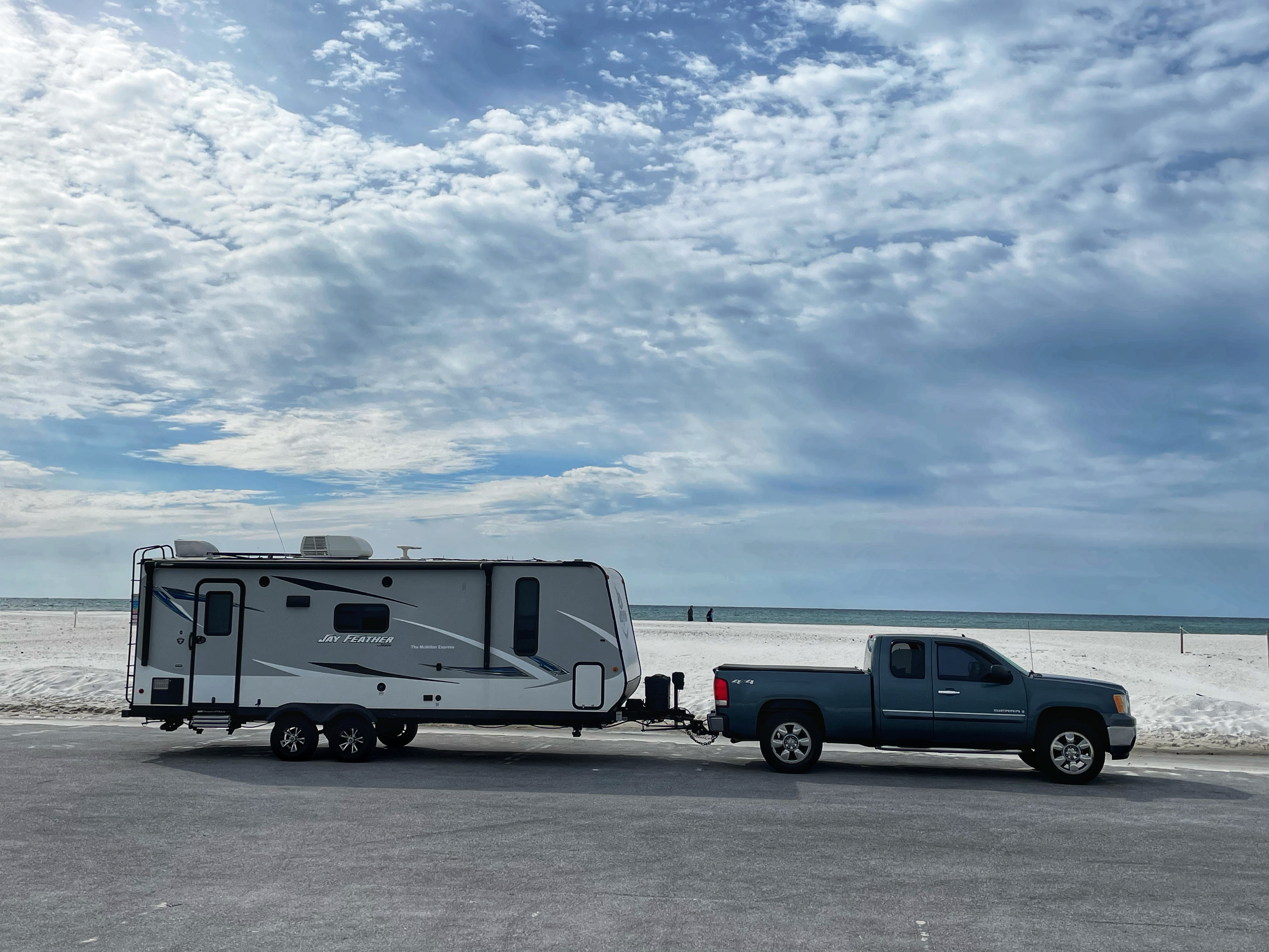 Ben and Christina McMillan's Jayco Jay Feather travel trailer at the beach near Fort Pickens