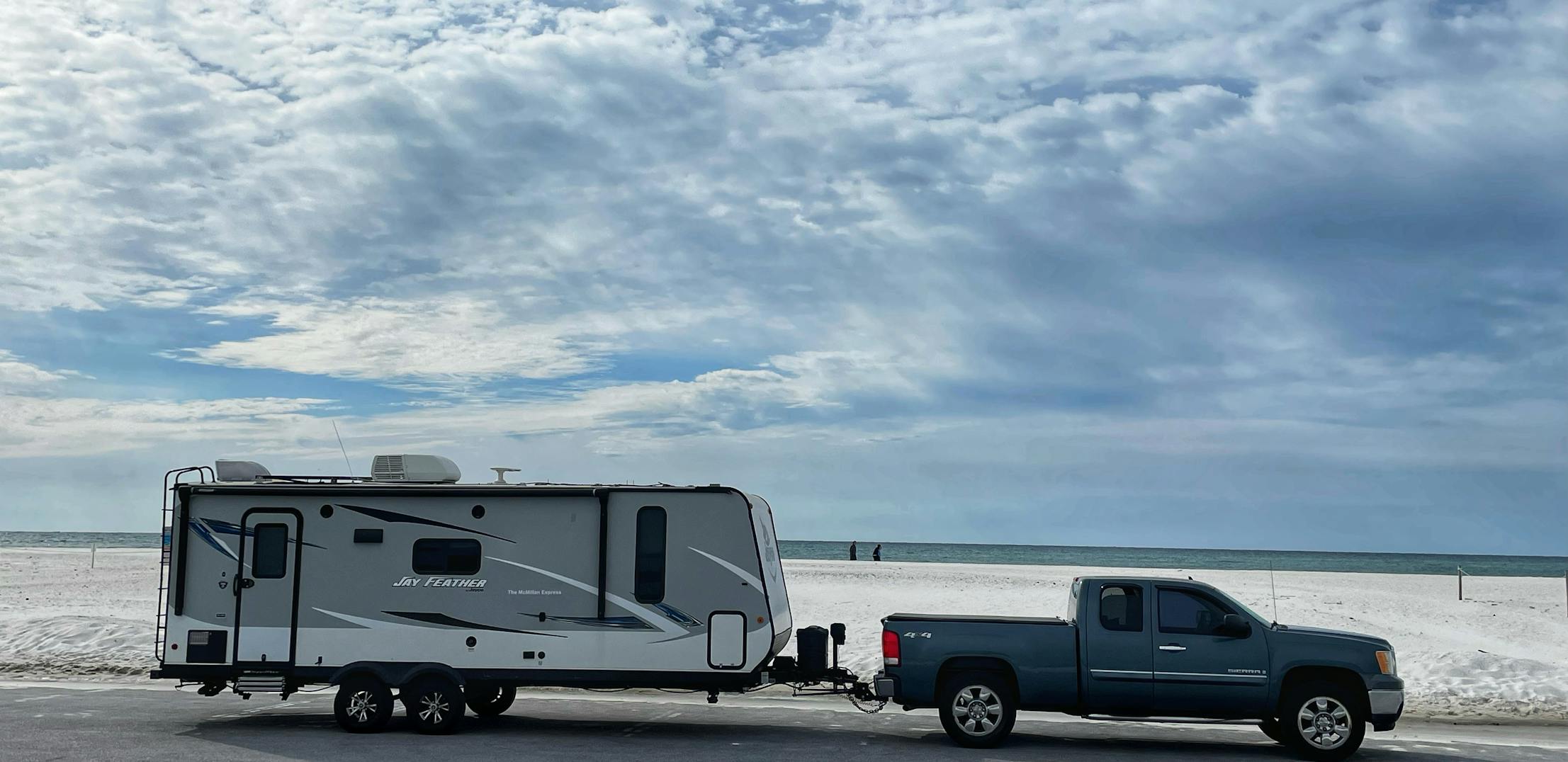 Ben and Christina McMillan's Jayco Jay Feather travel trailer at the beach near Fort Pickens