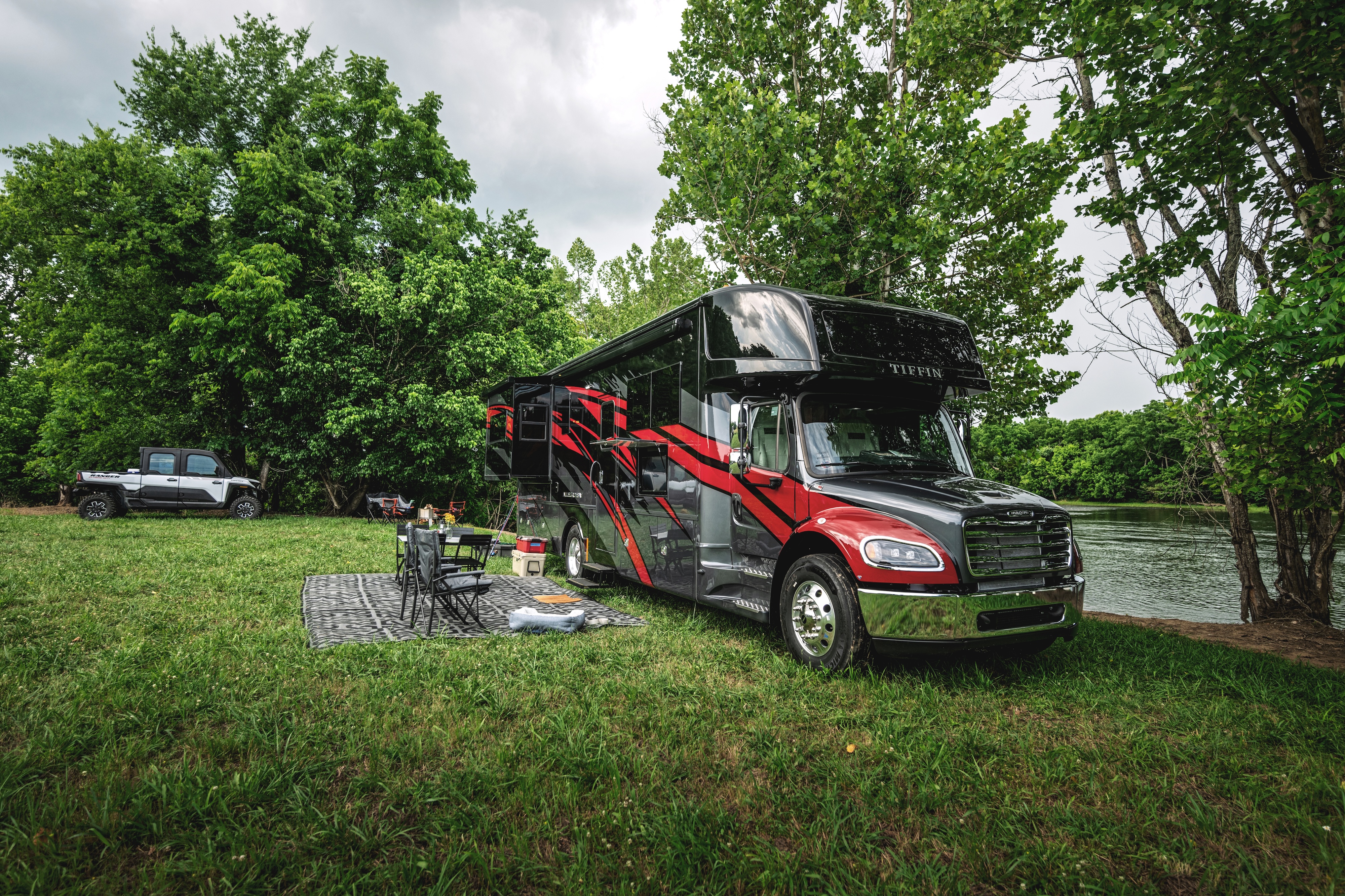 Tiffin Allegro Bay camping next to a river