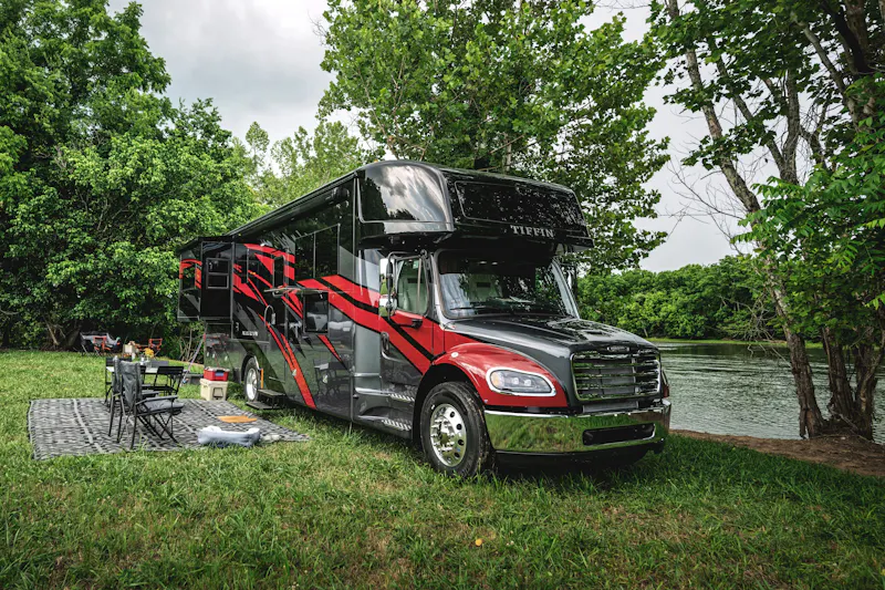 Tiffin Allegro Bay camping next to a river