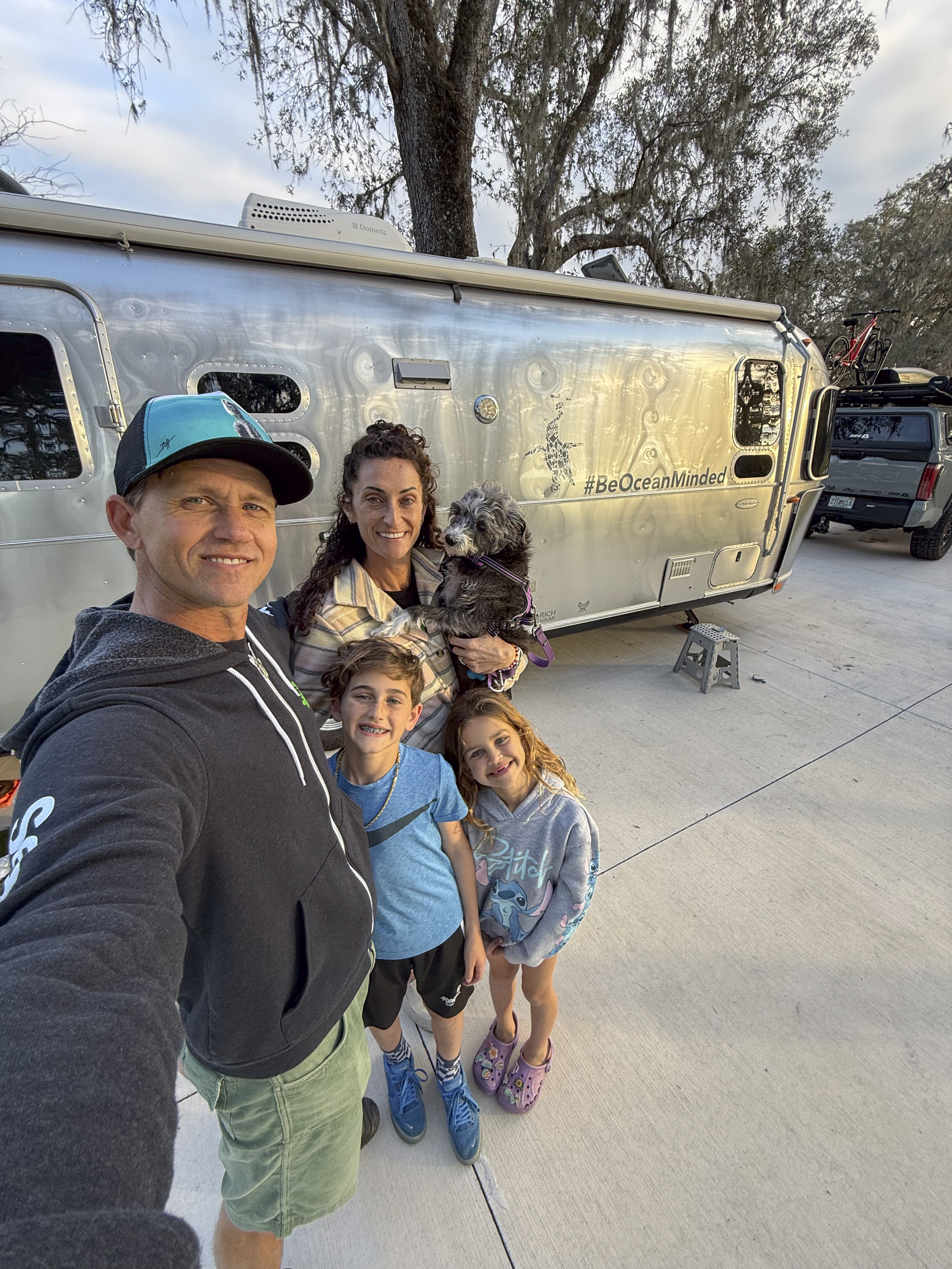 Ben Hicks and his family with their Airstream Flying Cloud.
