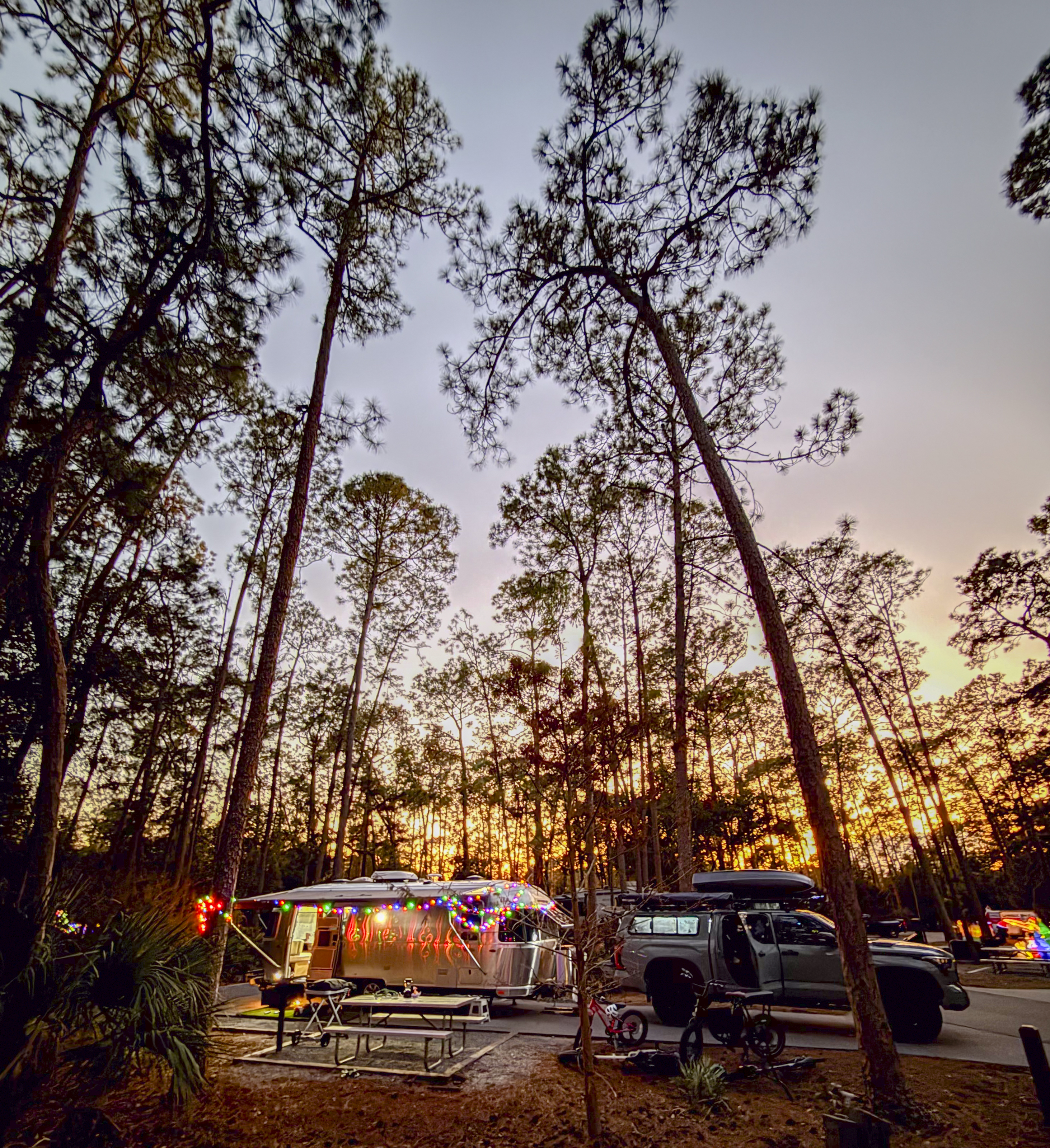 A campsite at sunset with Ben Hicks' Airstream Flying Cloud.