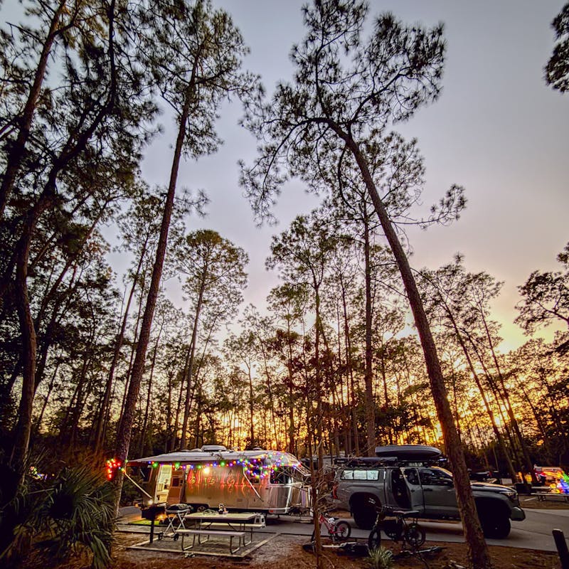 A campsite at sunset with Ben Hicks' Airstream Flying Cloud.