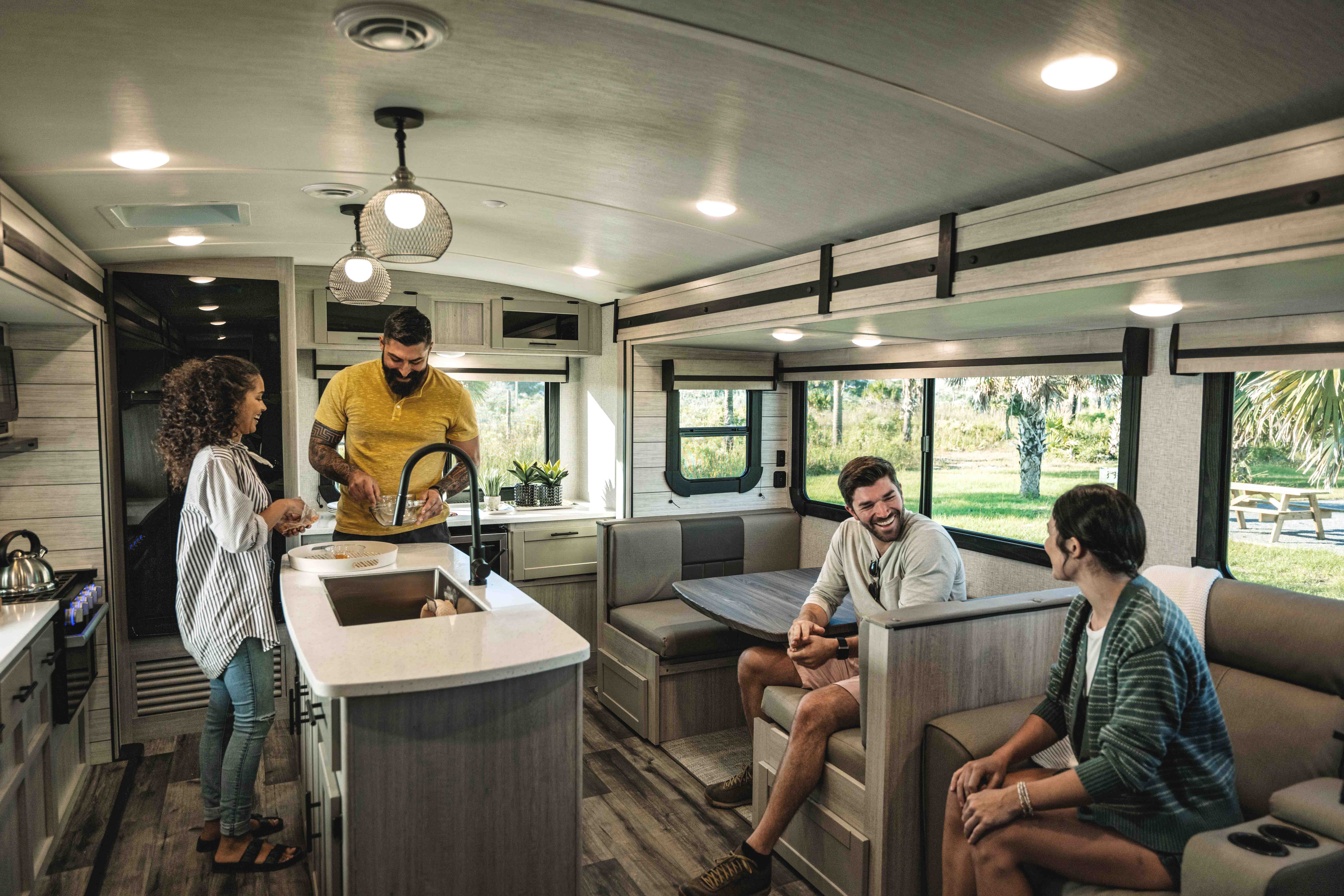 A group of friends hang out inside a Crossroads Sunset Trail.