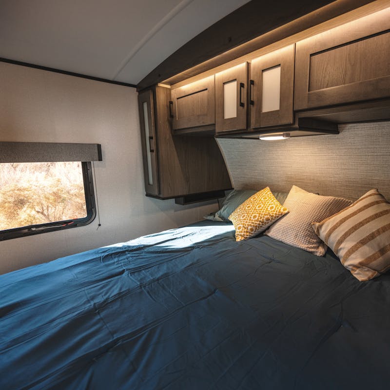 The bedroom inside a Cruiser MPG.