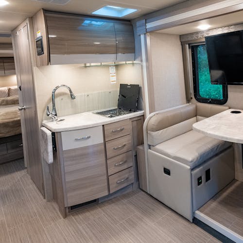 The kitchen and dinette inside Gabe and Rocio Rivero's Thor Motor Coach Delano.