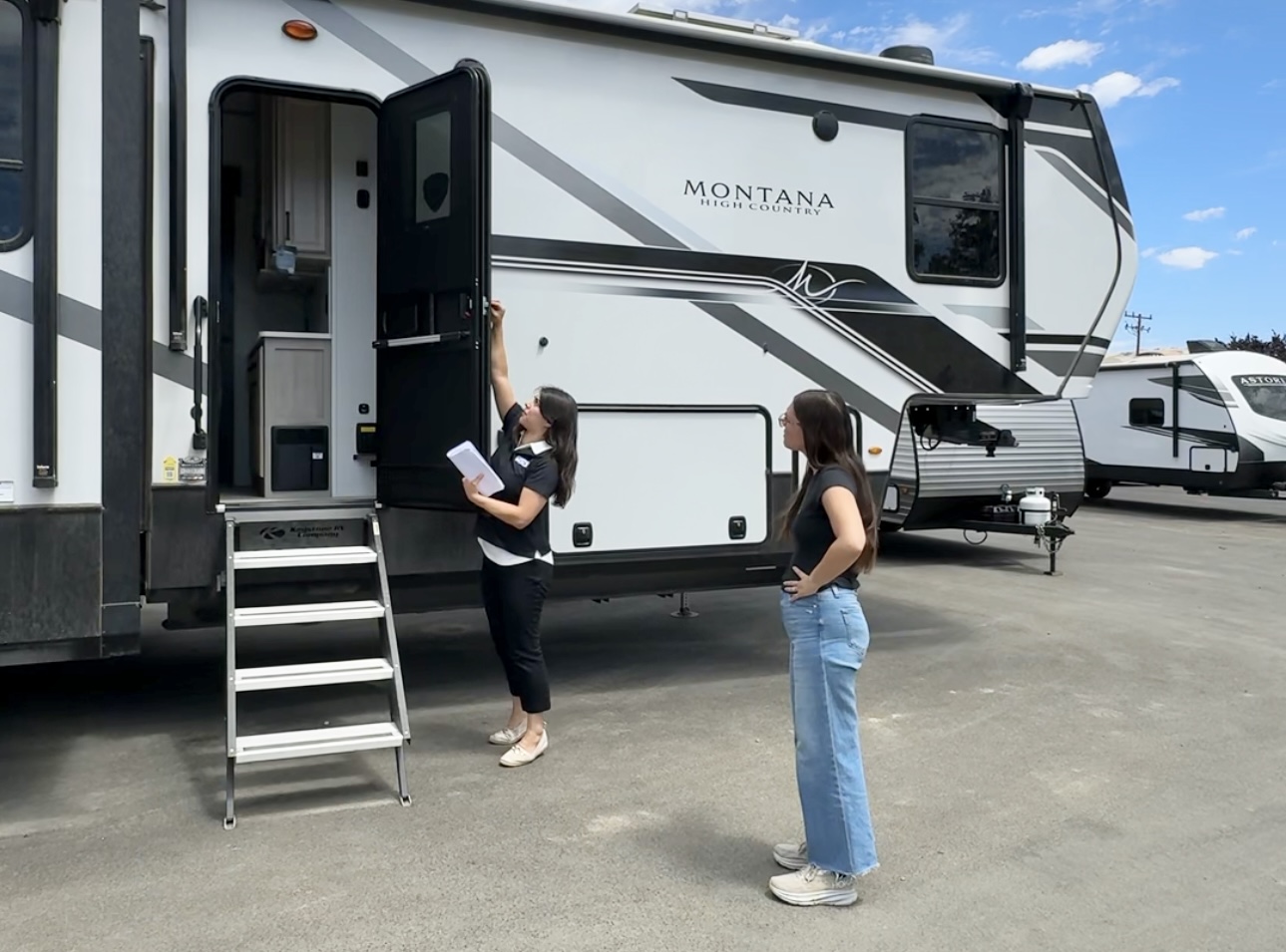 Bailey and Nicole Damberg explore different RVs at an RV show.