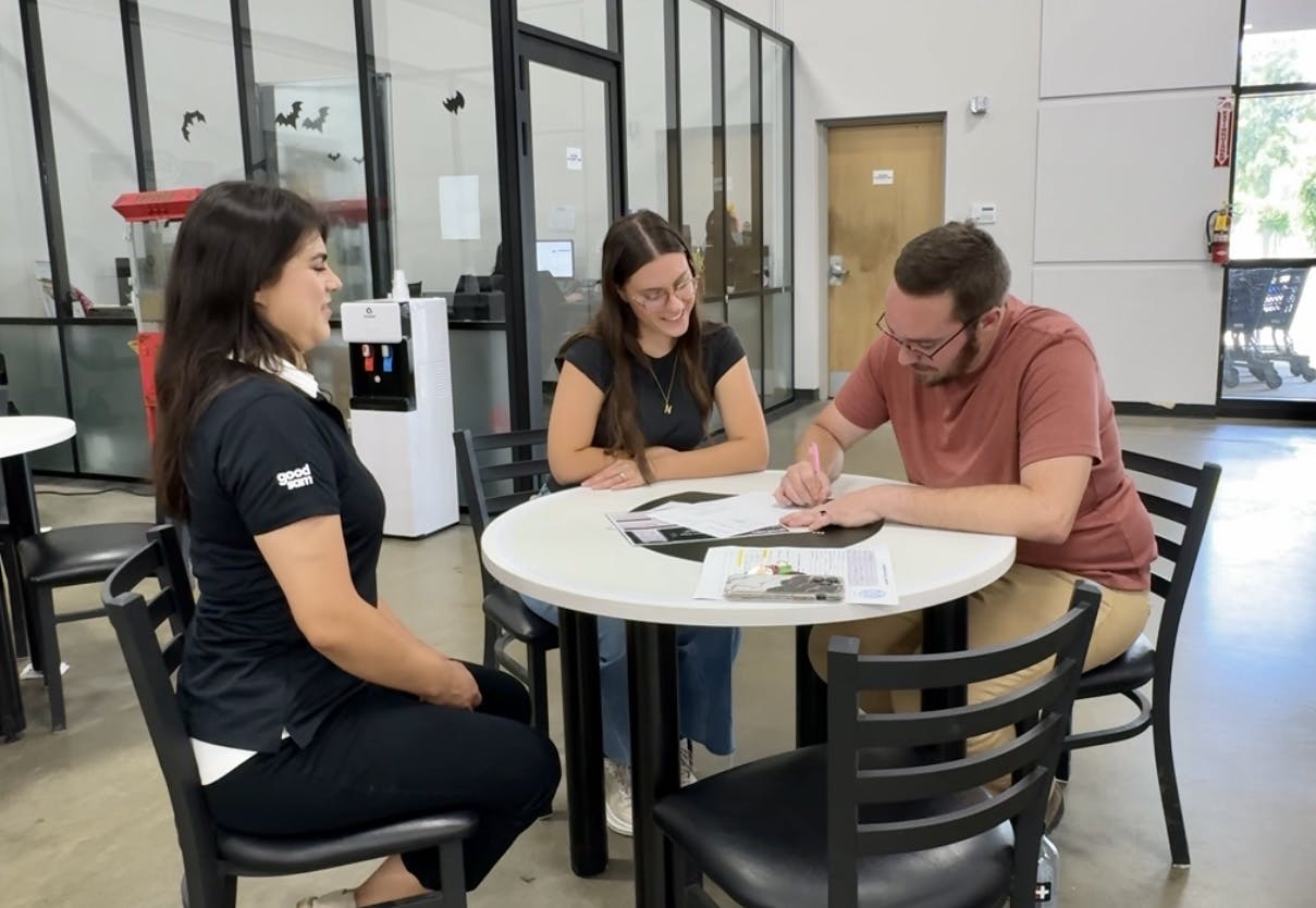 Bailey and Nicole Damberg at an RV dealership, checking out what their trade-in is worth.