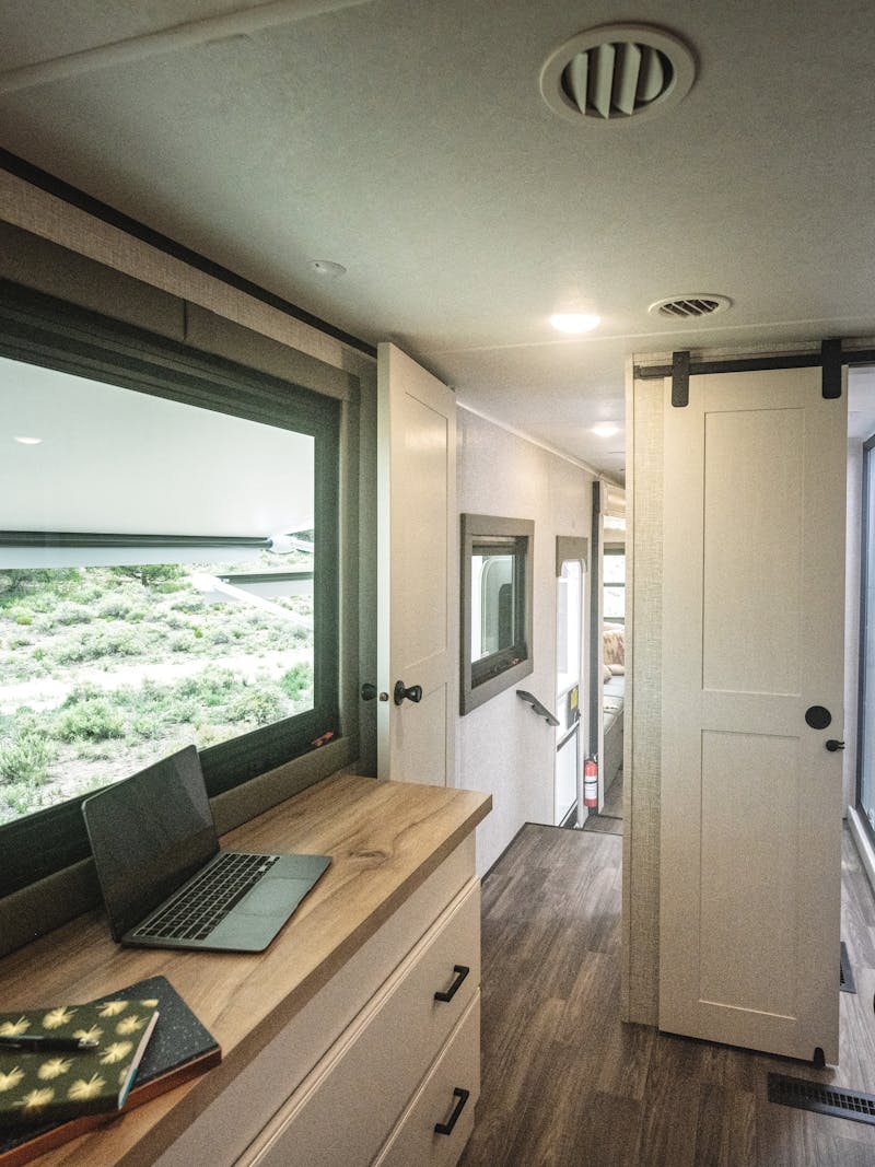 The bedroom inside a Highland Ridge Open Range travel trailer.