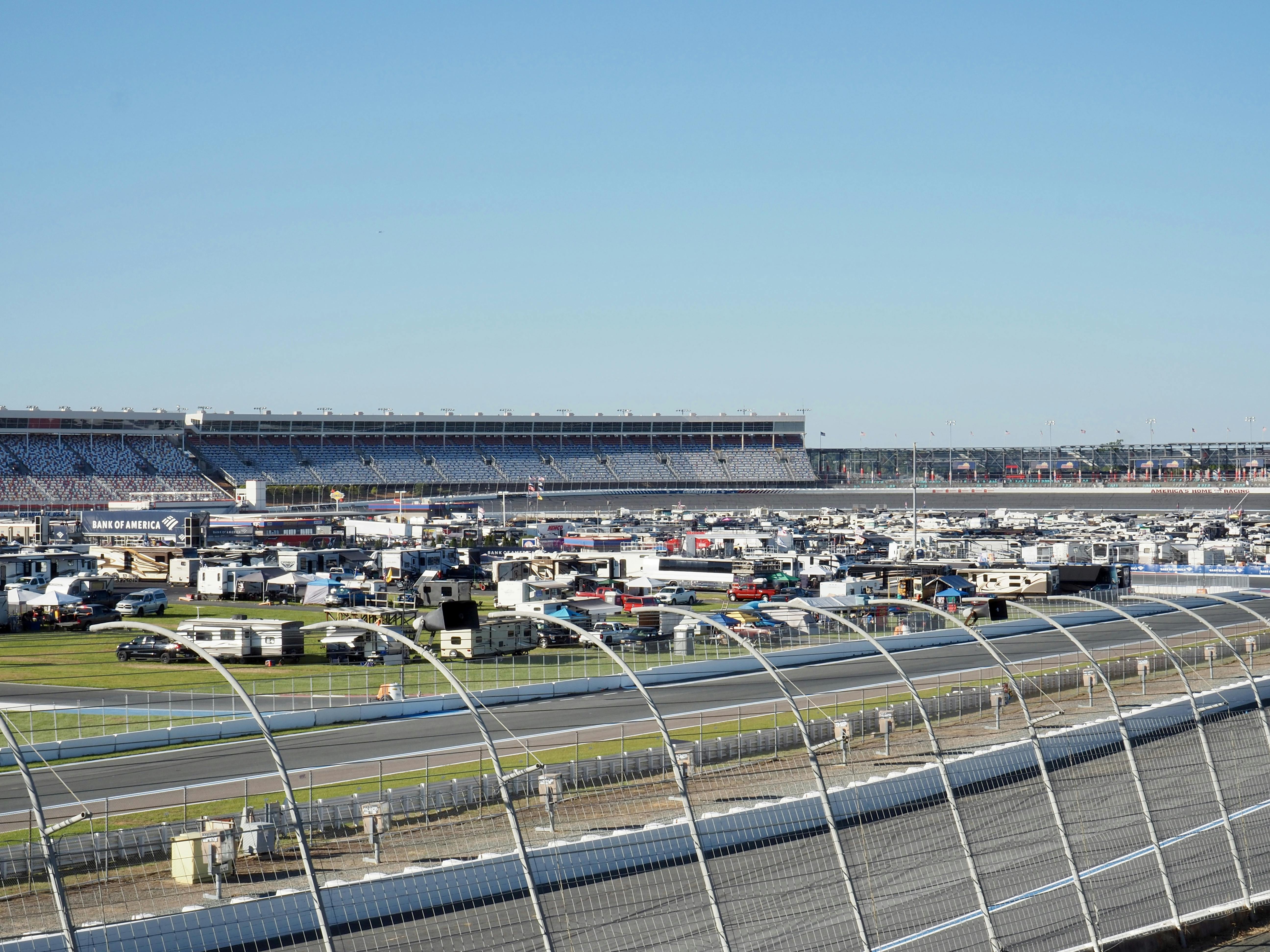 A view of the racetrack and infield RV camping at the Charlotte Motor Speedway in the day.