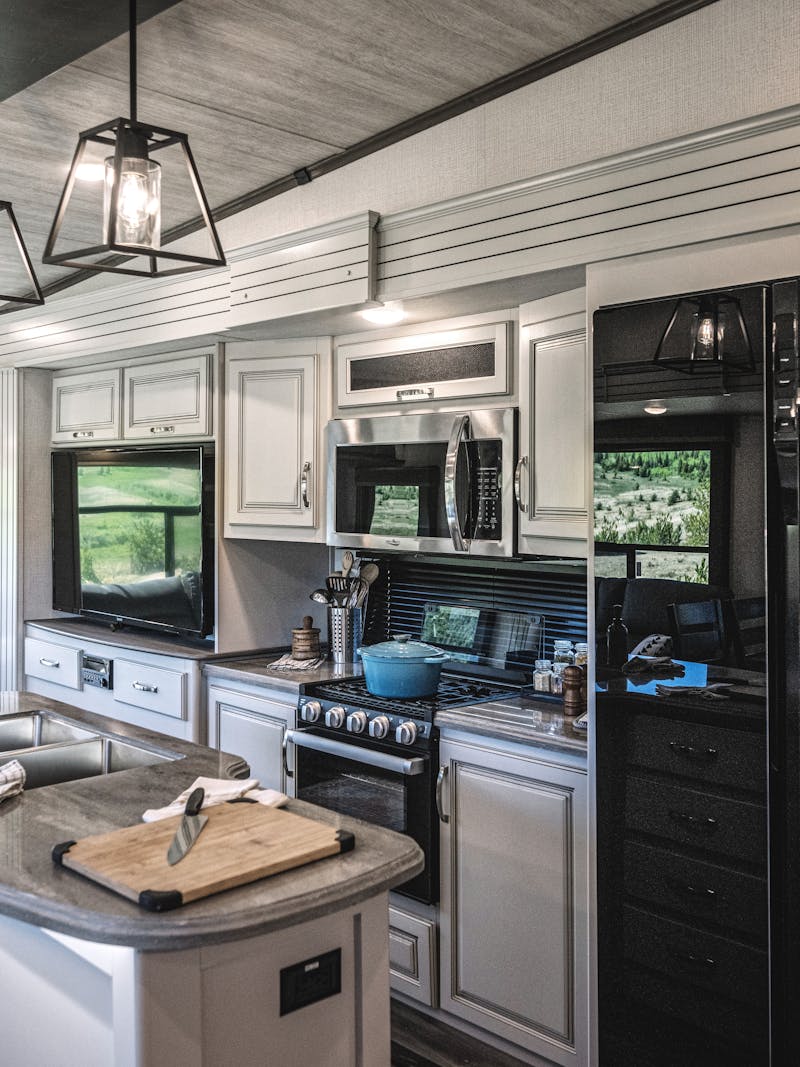 The kitchen area inside a Keystone Coguar Fifth Wheel.