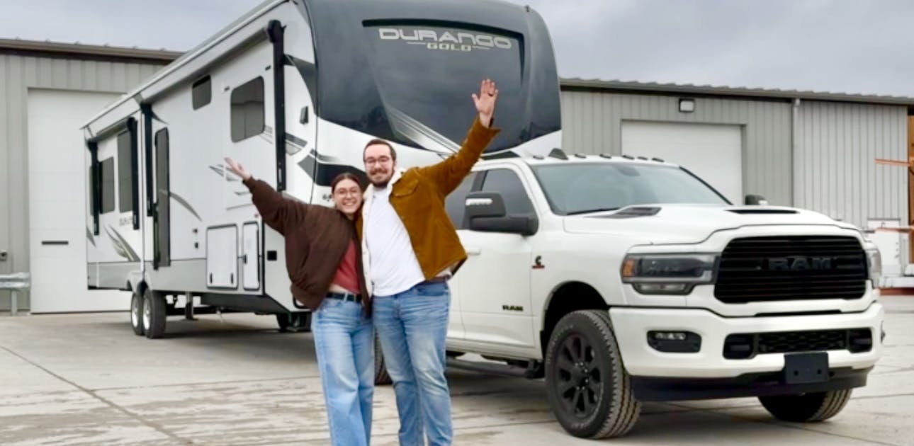 Bailey and Nicole Damberg in front of their KZ RV Durango Gold fifth wheel.