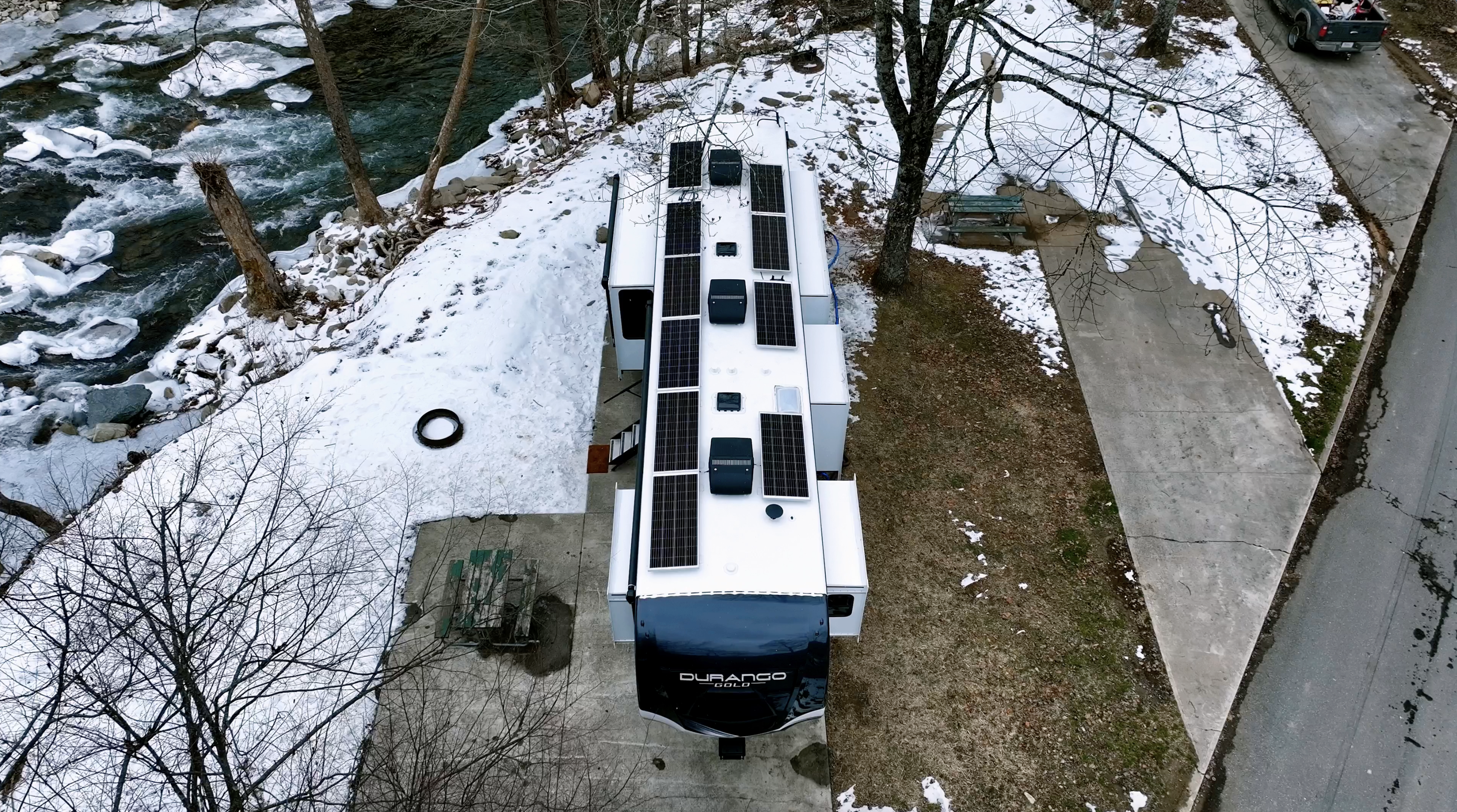 Bailey and Nicole Damberg's KZ RV Durango Gold fifth wheel at a snowy campsite.