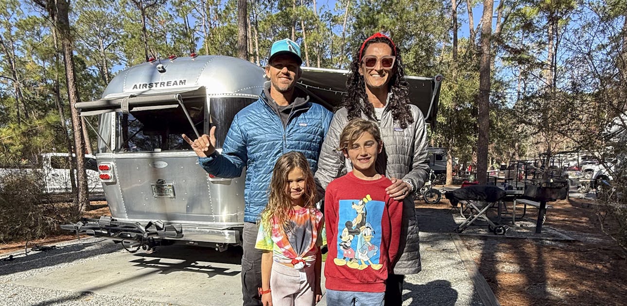 Ben Hicks and his family in front of their Airstream Flying Cloud.