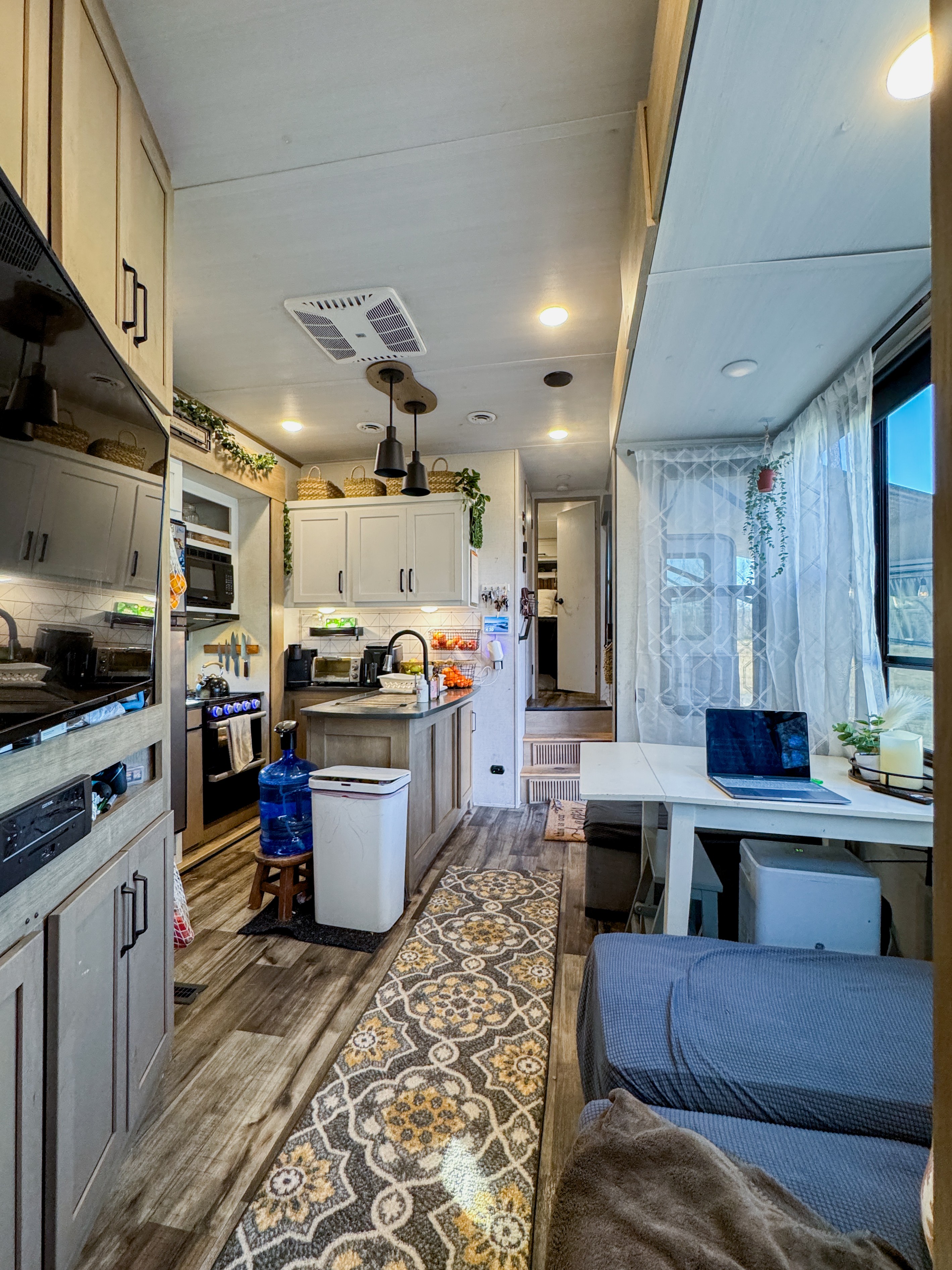 The kitchen and dinette inside Josh and Keren Stolvoort's Keystone Carbon toy hauler.