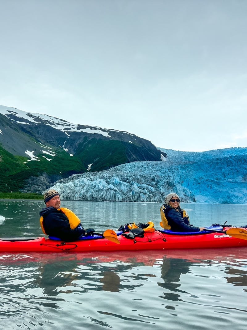 Patty and Shane Gill kayaking on a lake.