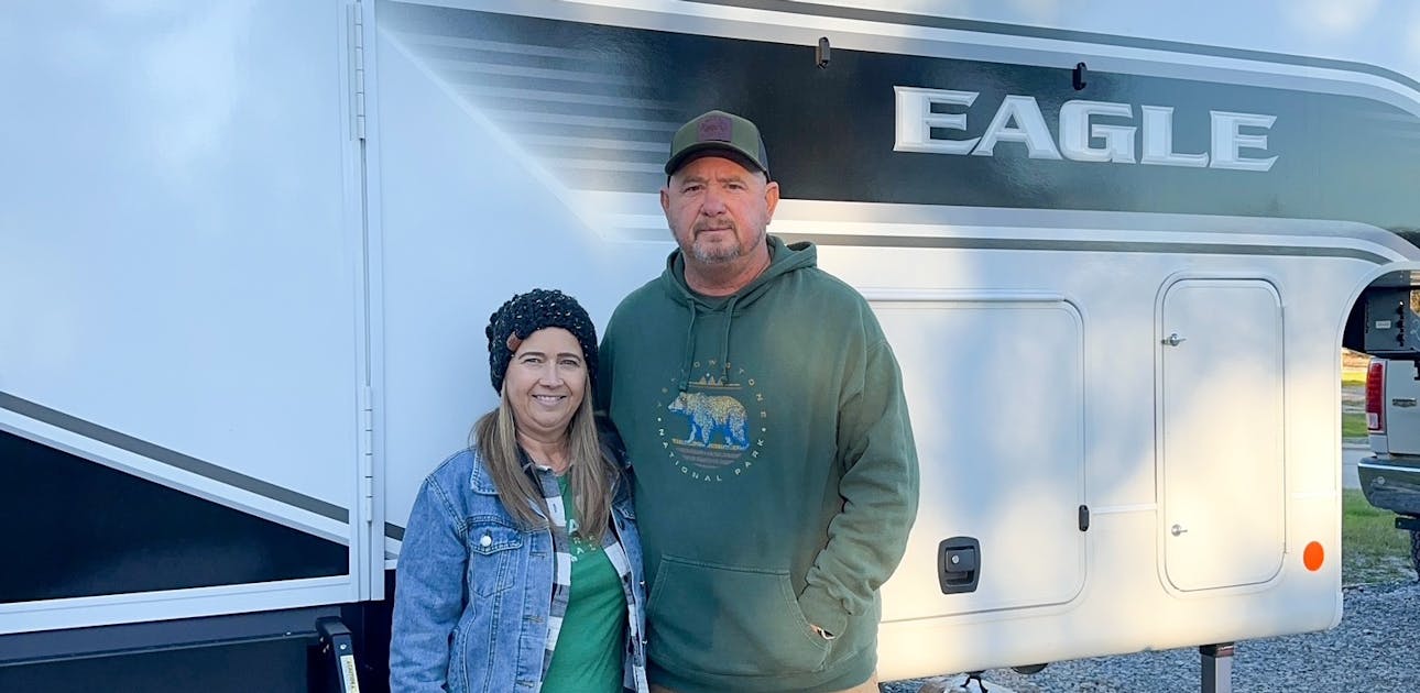 Patty and Shane Gill in front of their Patty Jayco Eagle fifth wheel.
