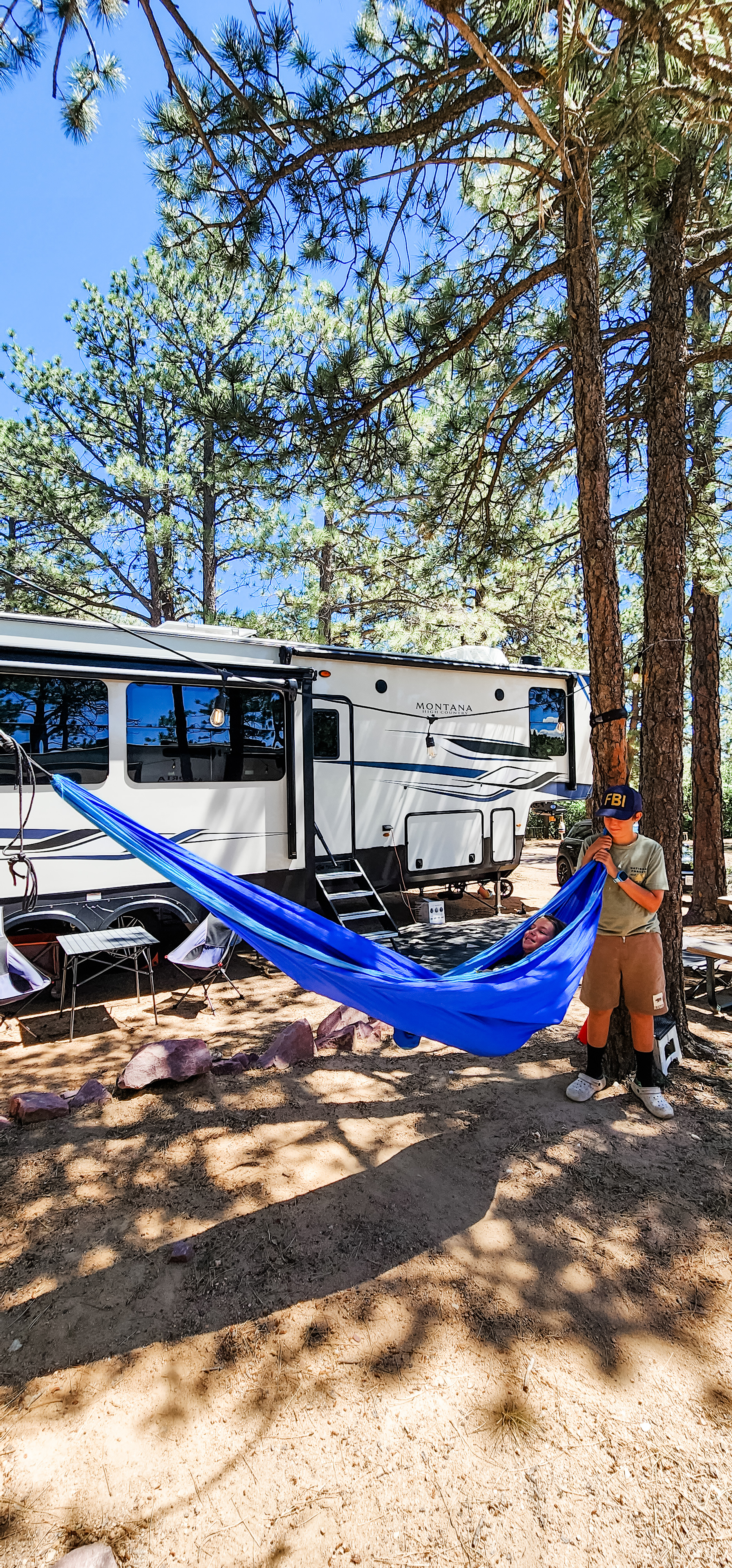 Kaylee and Steve Techau's Keystone Montana High Country fifth wheel and a hammock setup.