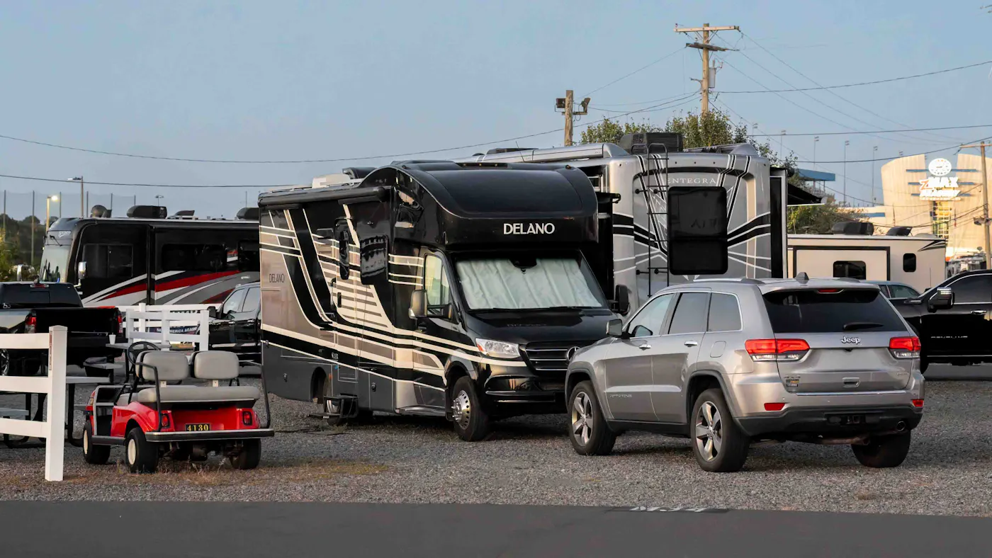 Gabe and Rocio Rivero's Thor Motor Coach Delano camping at a NASCAR race.