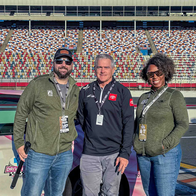 Gabe and Rocio Rivero with a NASCAR representative.
