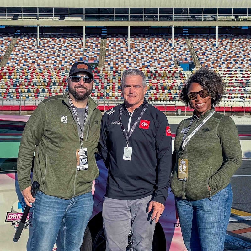 Gabe and Rocio Rivero with a NASCAR representative.