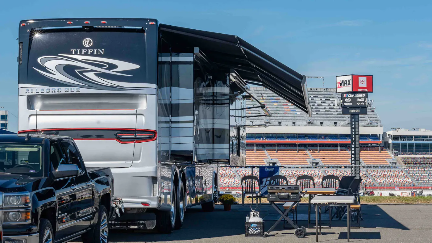A Tiffin Class A motorhome at a NASCAR race.