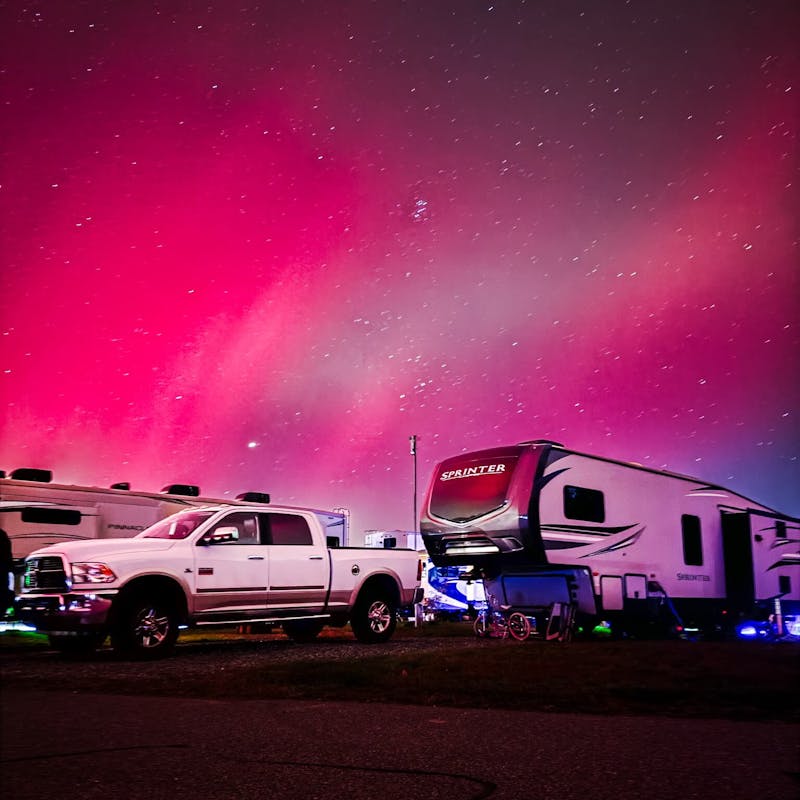 A starry night sky over Lia and Trevor Eyre's Keystone Sprinter fifth wheel.