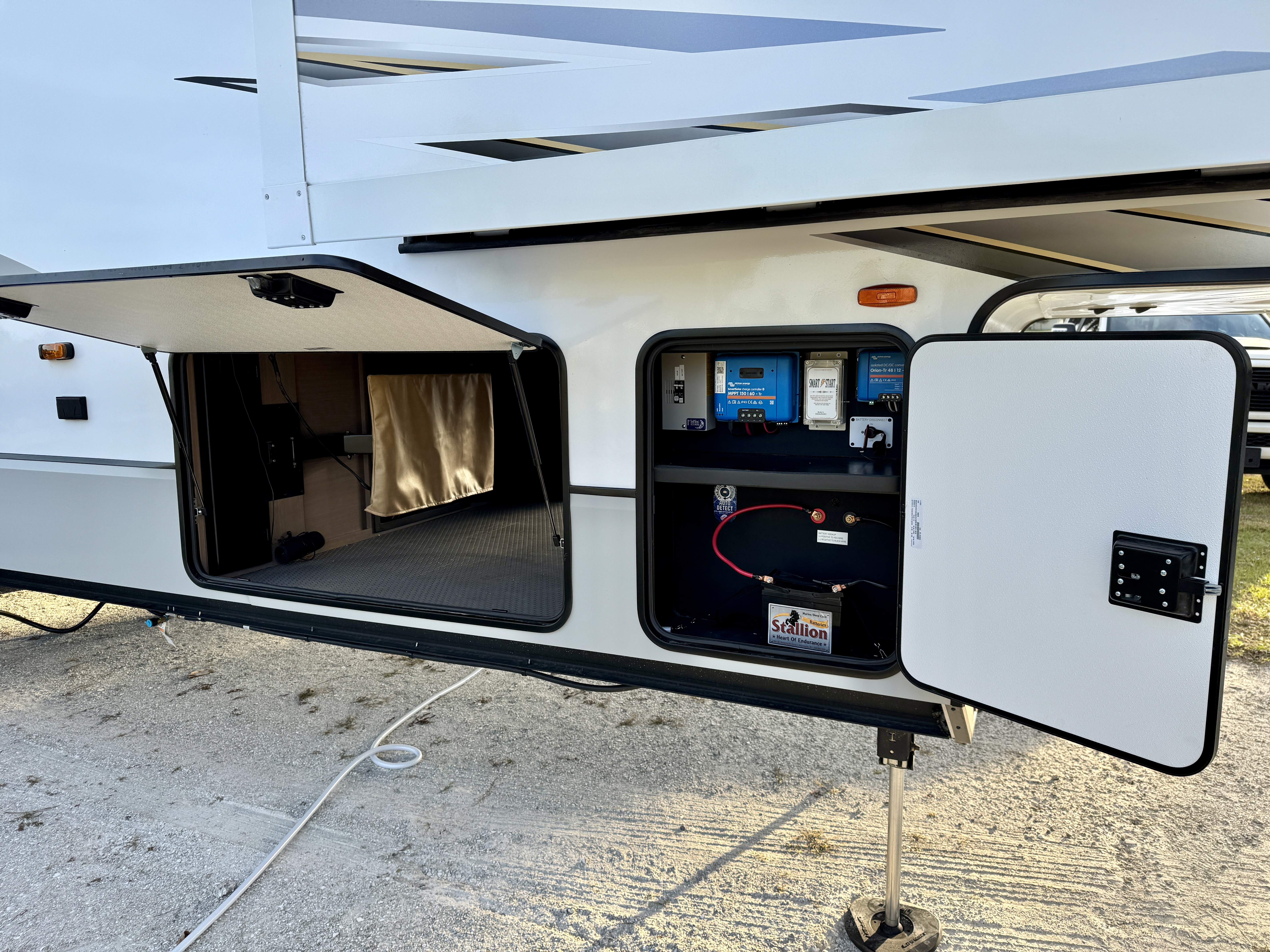 The exterior storage lockers and solar components on Bailey and Nicole Damberg's KZ Durango Gold fifth wheel.