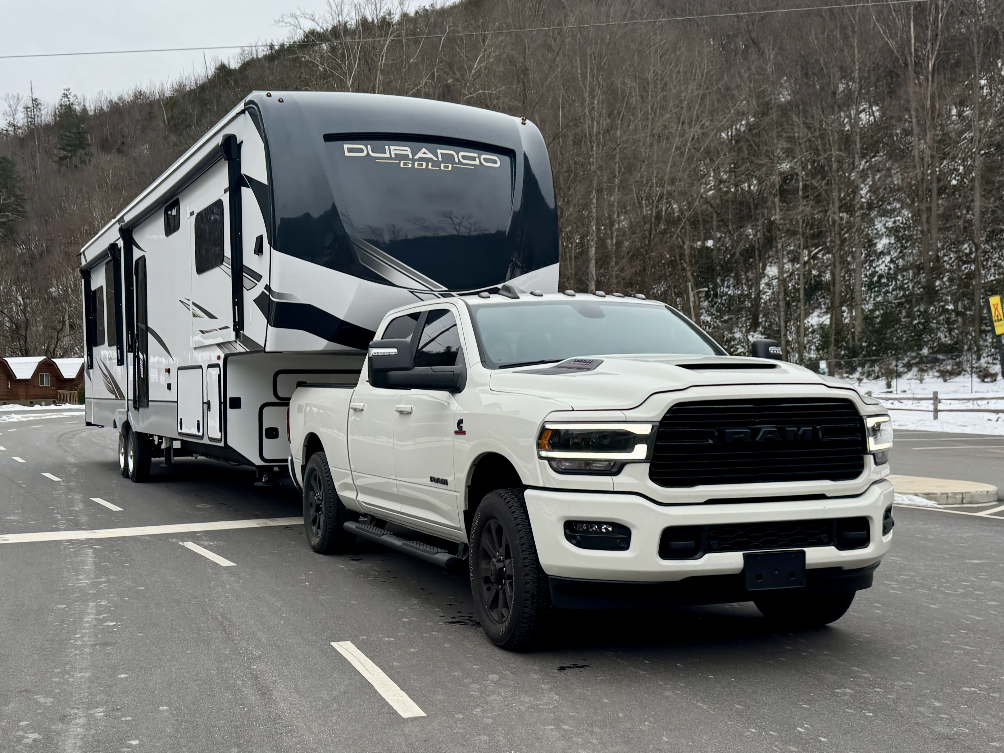 Bailey and Nicole Damberg's KZ Durango Gold fifth wheel being towed by a truck.