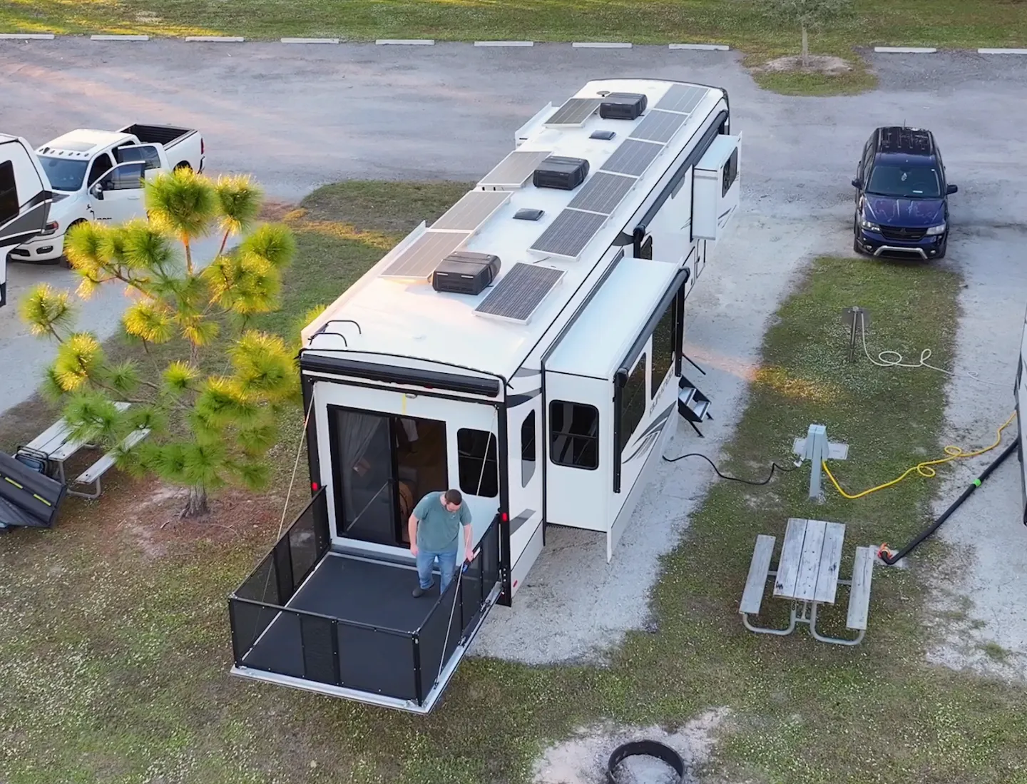 Bailey Damberg stands on the patio of his KZ Durango Gold fifth wheel.