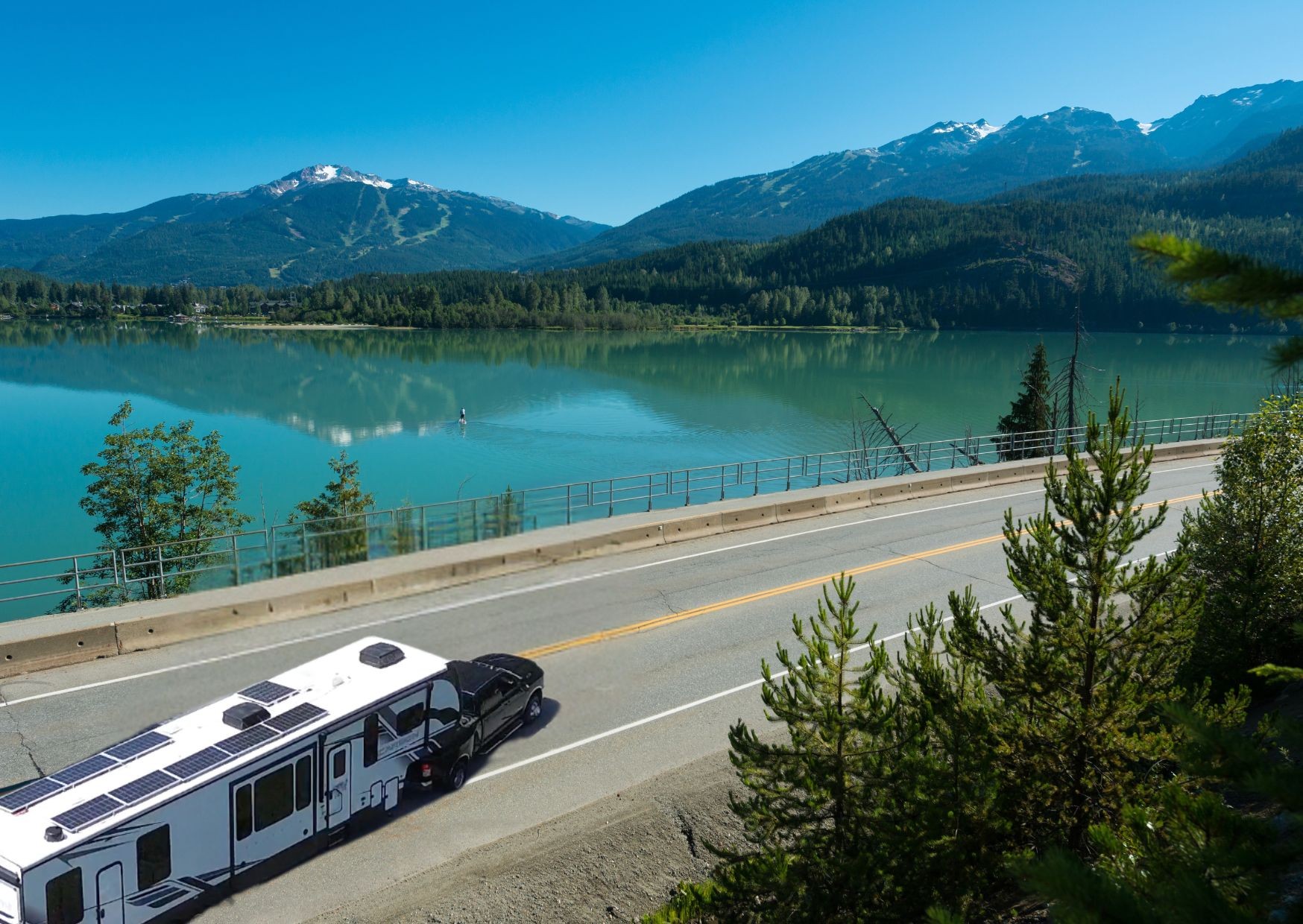 Josh and Keren Stolvoort's Keystone Carbon toy hauler at a scenic mountain overlook.