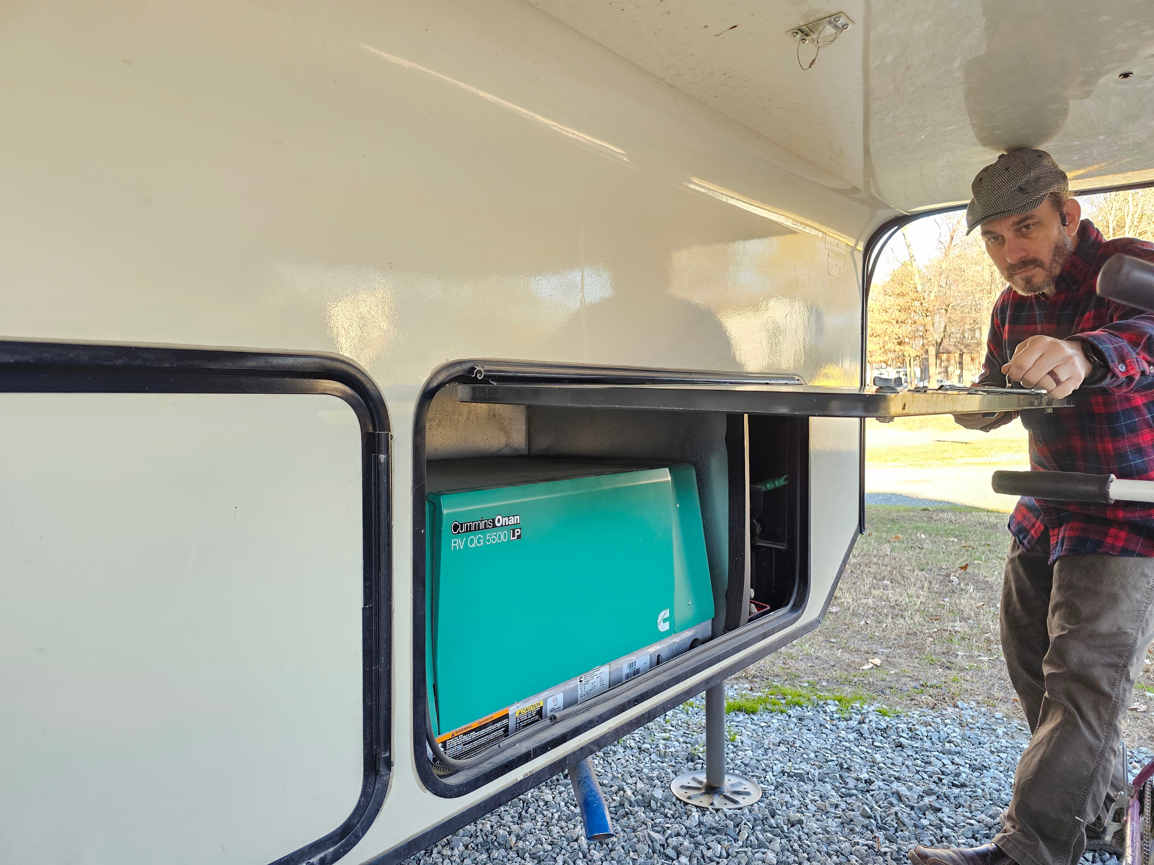JC Barringer checks his generator inside his KZ Durango fifth wheel.