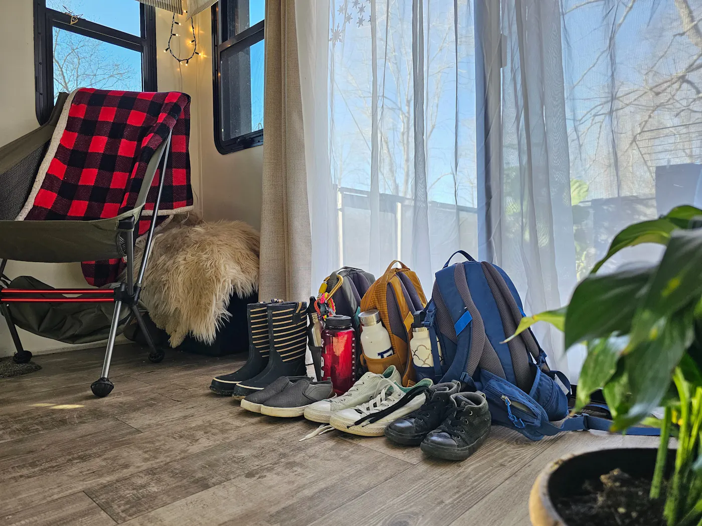 Shoes and emergency bags sit near the door inside JC and Bibi Barringer's KZ Durango fifth wheel.