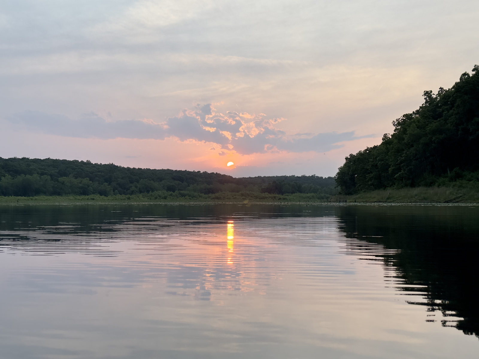 The sun sets over Crane Lake in Mark Twain National Forest.