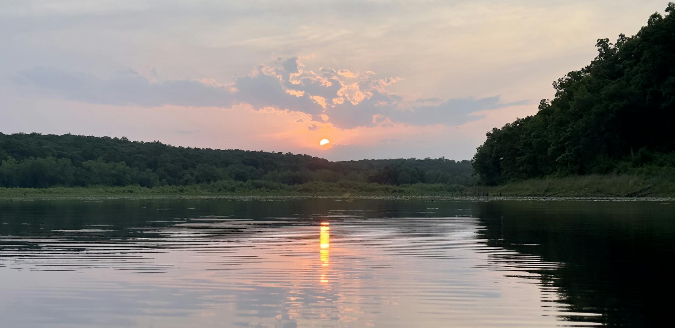 The sun sets over Crane Lake in Mark Twain National Forest.