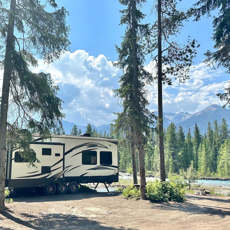 Melissa and Lucas Lahr's Heartland Torque toy hauler boondocking at a remote lake in the woods.