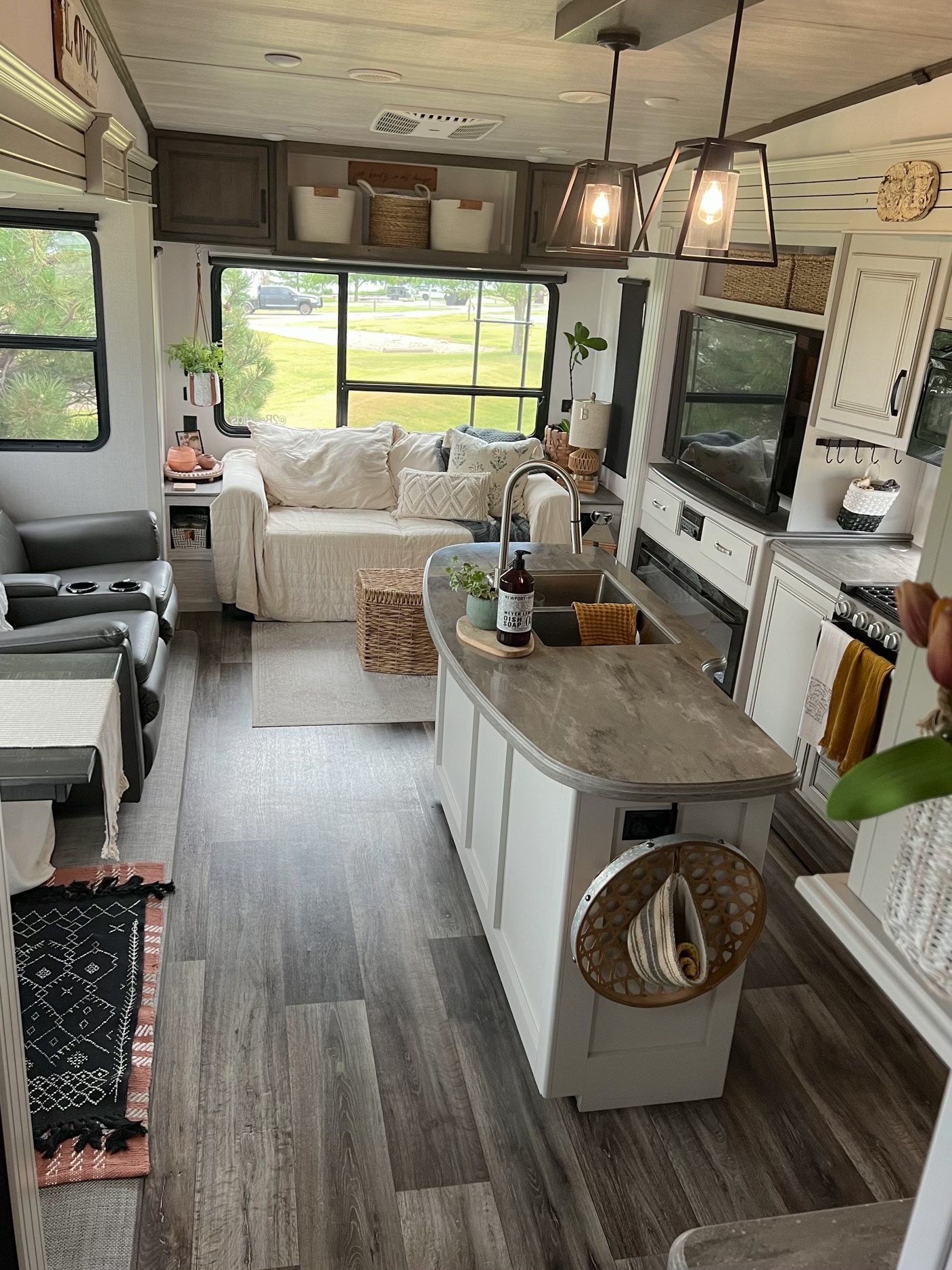 The living room, kitchen, and dinette inside Donny and Tammy Benedict's Keystone Cougar fifth wheel.