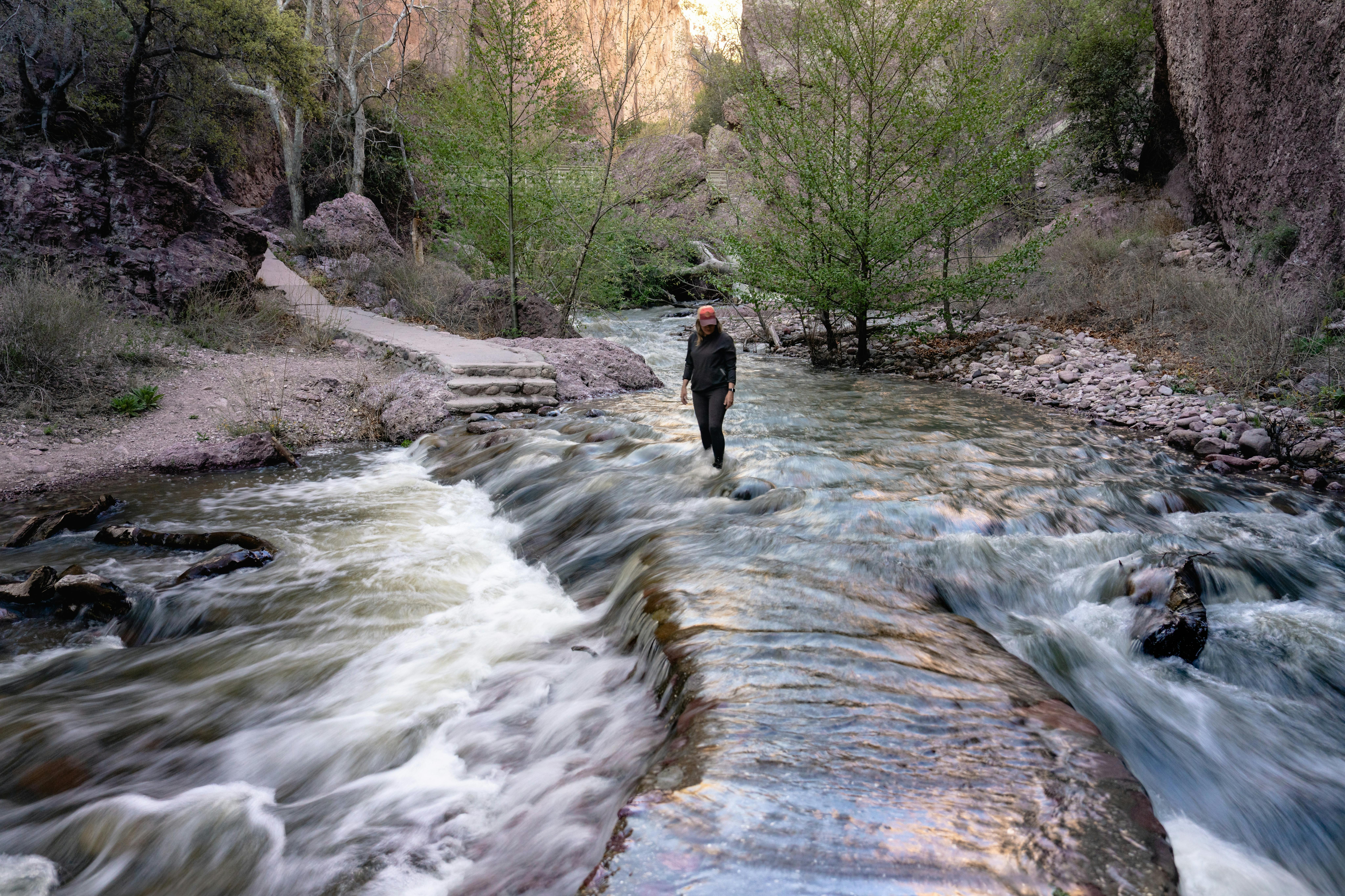 Karen Blue standing in a river in Gila National Forest.