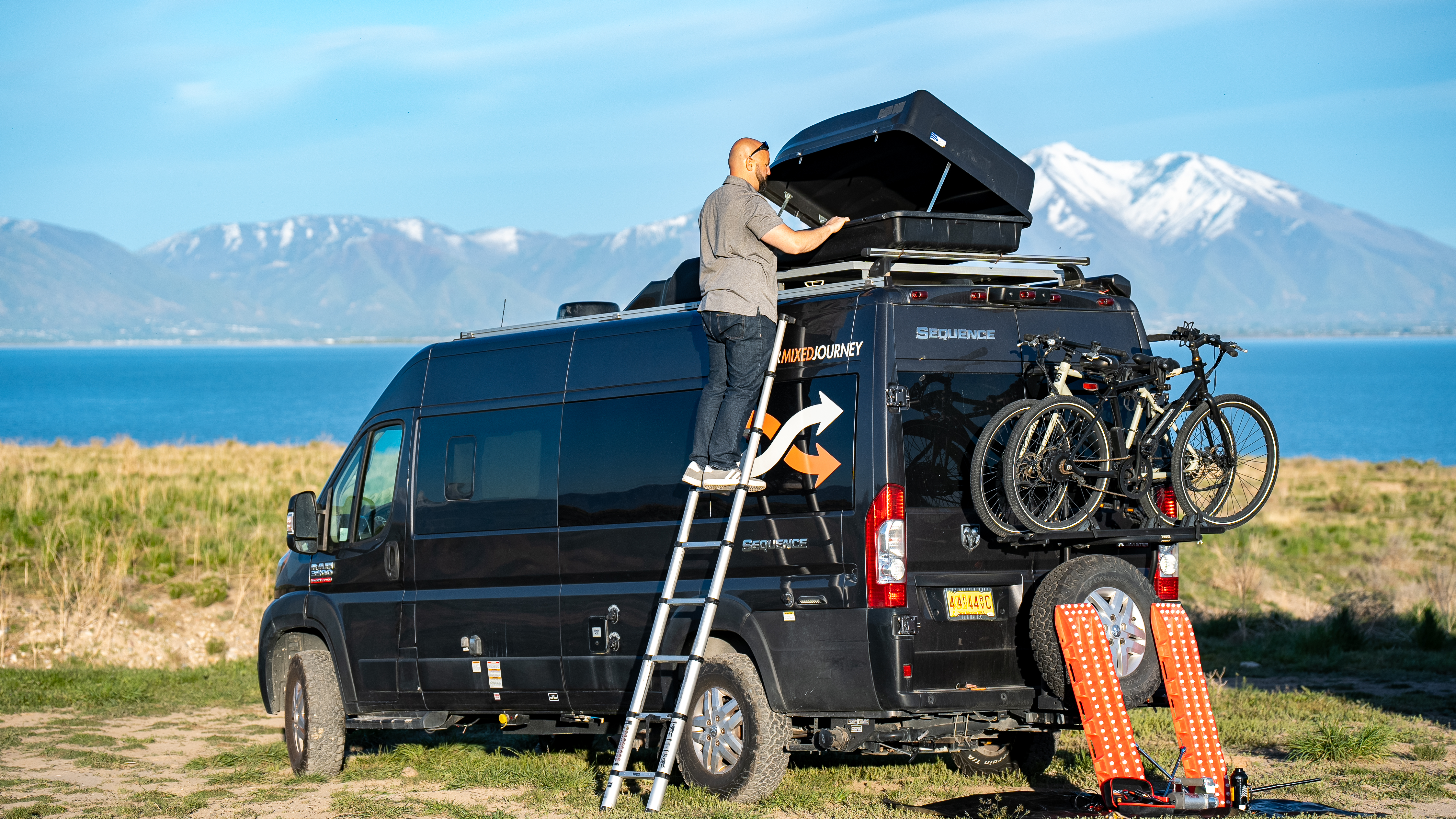 Gabe Rivero opens the exterior rooftop storage on his Thor Motor Coach Sequence.